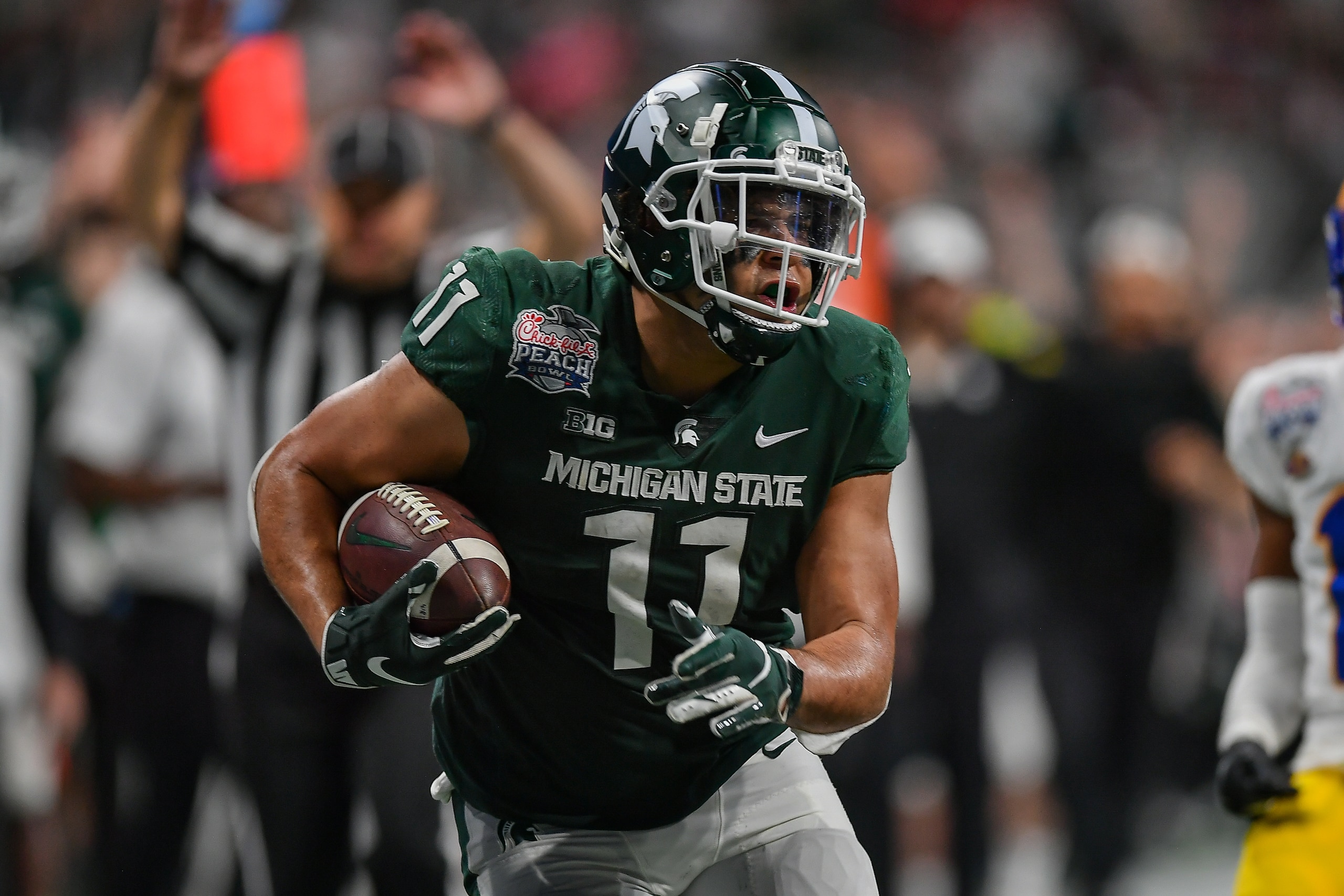 ATLANTA, GA  DECEMBER 30:  Michigan State tight end Connor Heyward (11) runs with the ball during the Chick-fil-A Peach Bowl between the Michigan State Spartans and Pittsburgh Panthers on December 30th, 2021 at Mercedes Benz Stadium in Atlanta, GA.  (Photo by Rich von Biberstein/Icon Sportswire via Getty Images)
