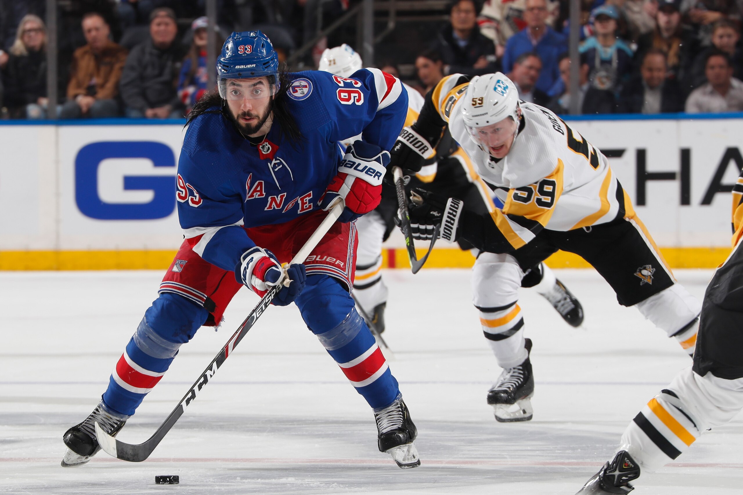 NEW YORK, NY - APRIL 07:  Mika Zibanejad #93 of the New York Rangers skates with the puck against the Pittsburgh Penguins at Madison Square Garden on April 7, 2022 in New York City. (Photo by Jared Silber/NHLI via Getty Images)