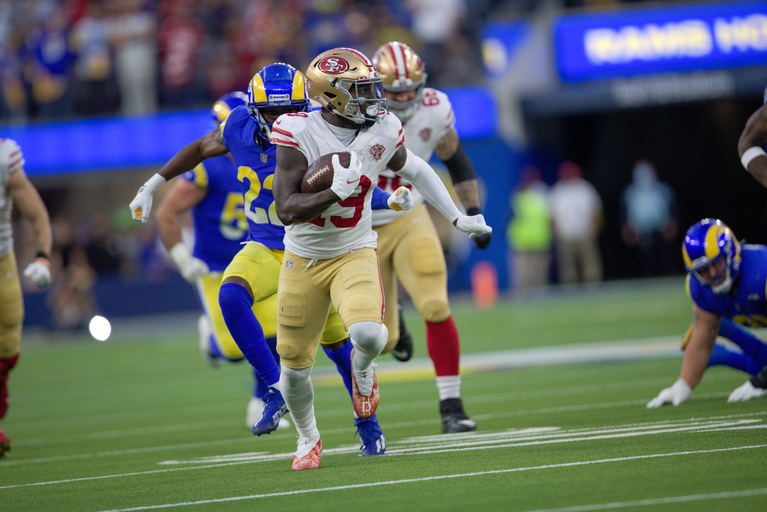 INGLEWOOD, CA - JANUARY 30: Deebo Samuel #19 of the San Francisco 49ers heads to the end zone on a 44-yard touchdown catch during the game against the Los Angeles Rams at SoFi Stadium on January 30, 2022 in Inglewood, California. The Rams defeated the 49ers 20-17. (Photo by Michael Zagaris/San Francisco 49ers/Getty Images)