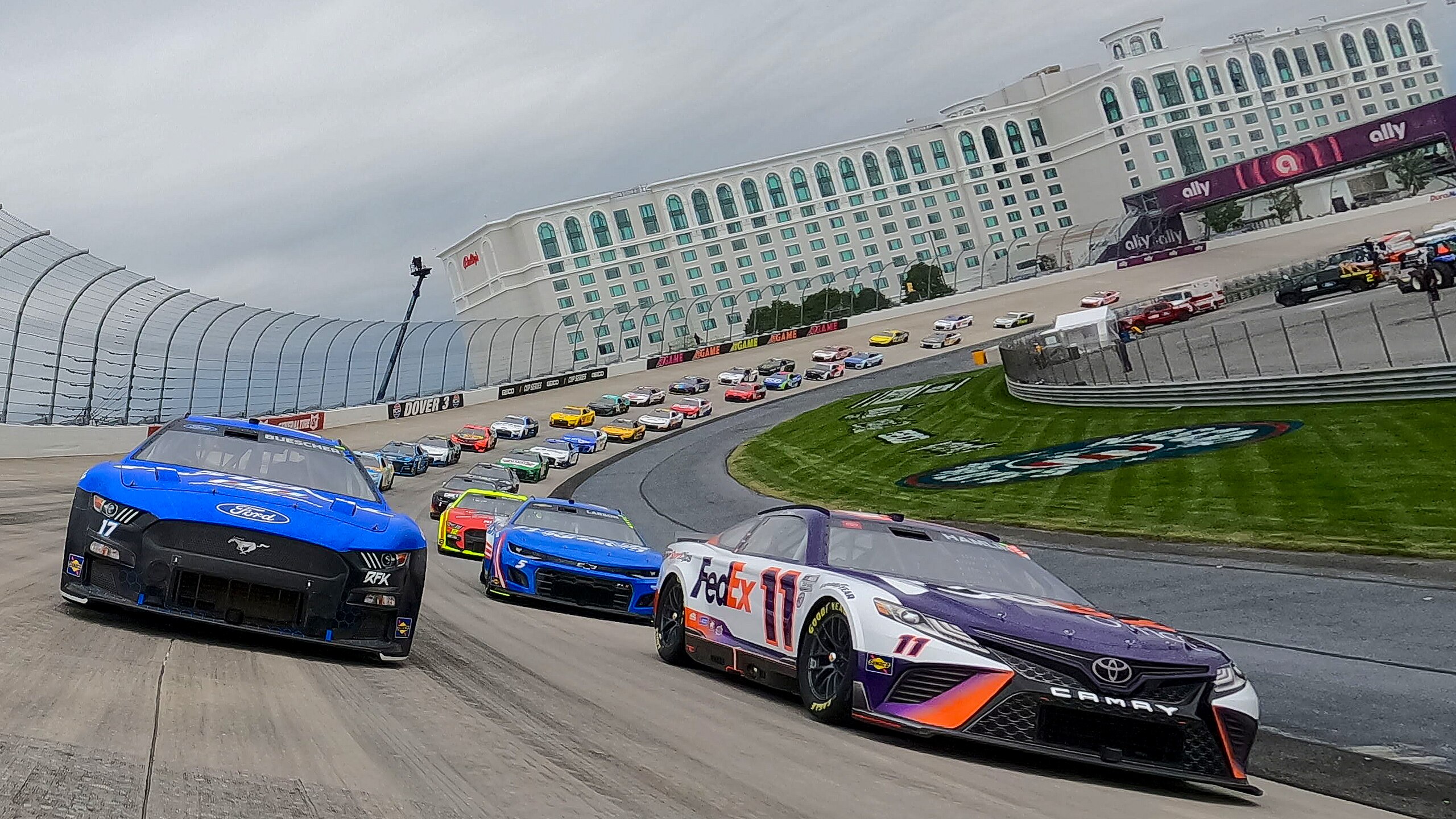 DOVER, DELAWARE - MAY 01: Chris Buescher, driver of the #17 Fastenal Ford, and Denny Hamlin, driver of the #11 FedEx Office Toyota, lead the field on a pace lap prior to the NASCAR Cup Series DuraMAX Drydene 400 presented by RelaDyne at Dover Motor Speedway on May 01, 2022 in Dover, Delaware. (Photo by Sean Gardner/Getty Images)
