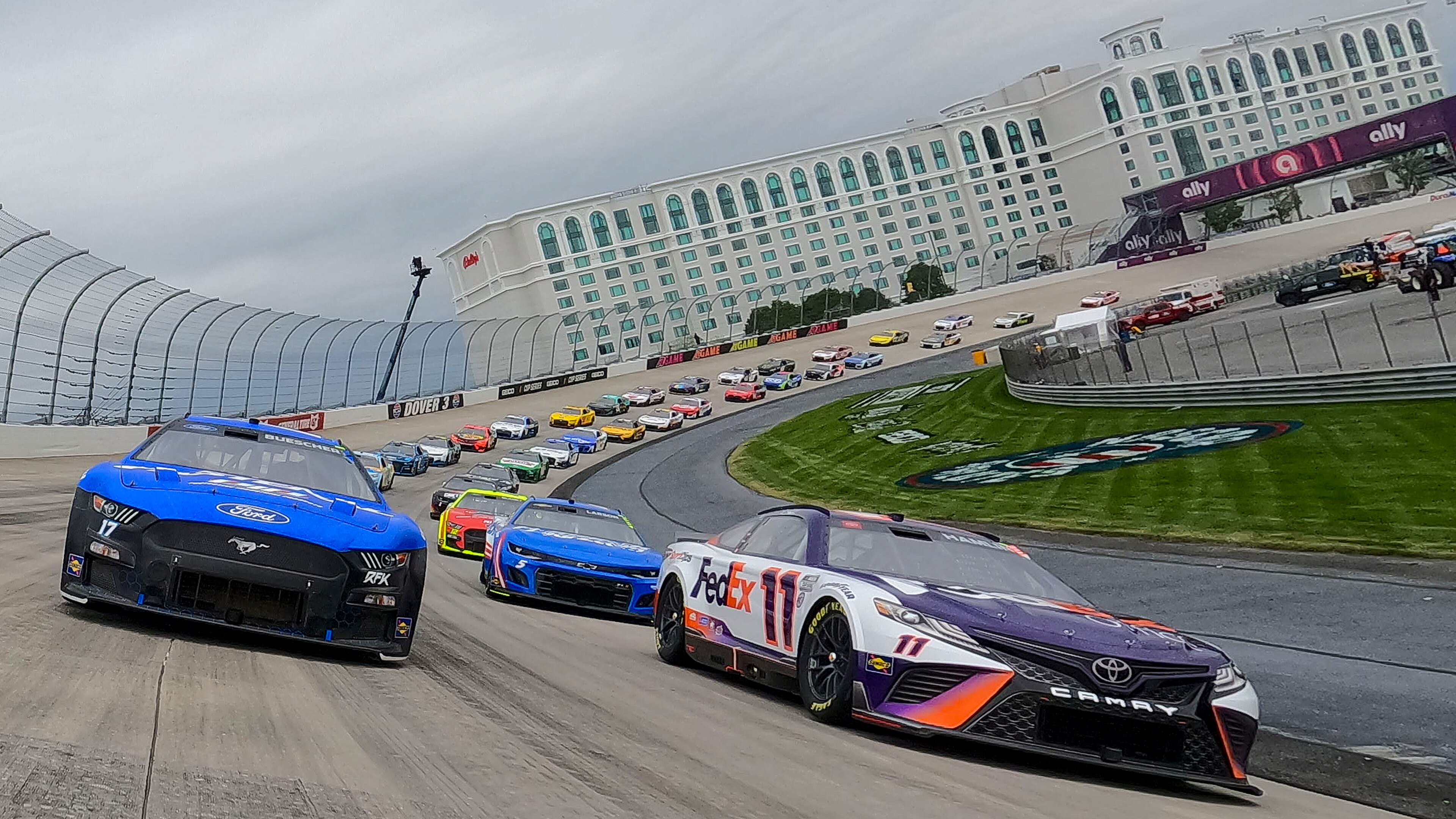 DOVER, DELAWARE - MAY 01: Chris Buescher, driver of the #17 Fastenal Ford, and Denny Hamlin, driver of the #11 FedEx Office Toyota, lead the field on a pace lap prior to the NASCAR Cup Series DuraMAX Drydene 400 presented by RelaDyne at Dover Motor Speedway on May 01, 2022 in Dover, Delaware. (Photo by Sean Gardner/Getty Images)