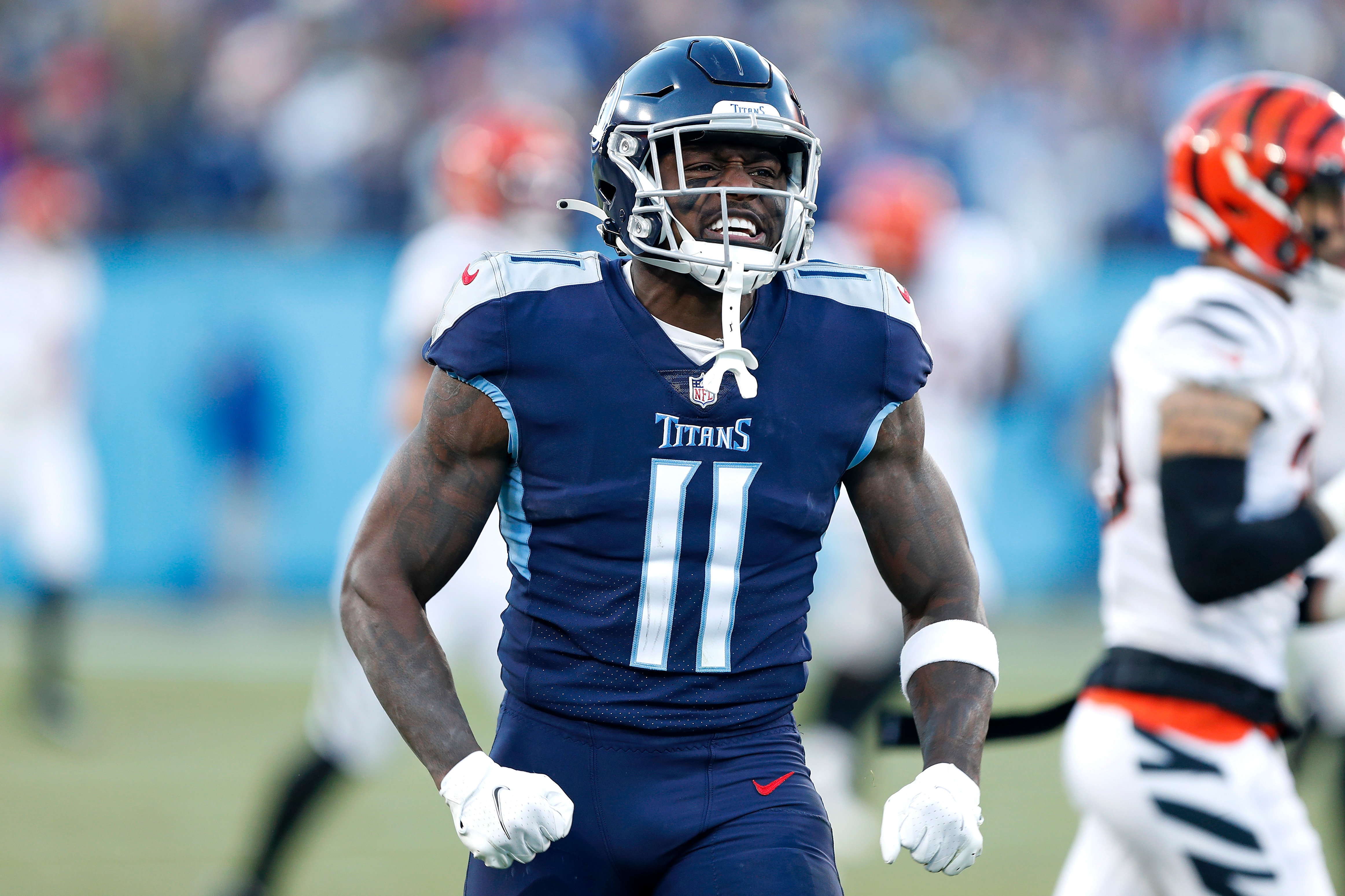 NASHVILLE, TENNESSEE - JANUARY 22: Wide receiver A.J. Brown #11 of the Tennessee Titans celebrates after catching a second quarter pass against the Cincinnati Bengals in the AFC Divisional Playoff game at Nissan Stadium on January 22, 2022 in Nashville, Tennessee. (Photo by Wesley Hitt/Getty Images)