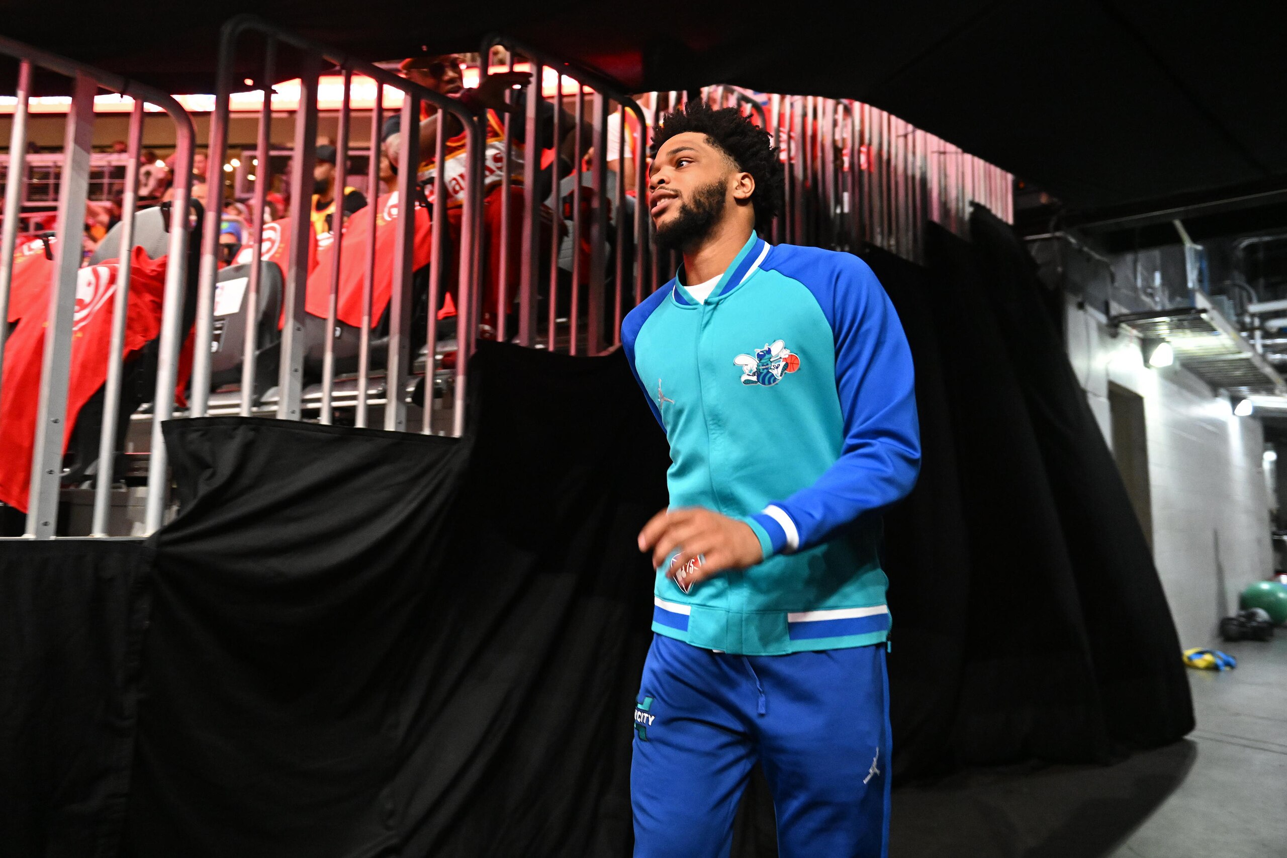 ATLANTA, GA - APRIL 13: Miles Bridges #0 of the Charlotte Hornets walks onto the court prior to the game against the Atlanta Hawks during the 2022 Play-In Tournament on April 13, 2022 at State Farm Arena in Atlanta, Georgia.  NOTE TO USER: User expressly acknowledges and agrees that, by downloading and/or using this Photograph, user is consenting to the terms and conditions of the Getty Images License Agreement. Mandatory Copyright Notice: Copyright 2022 NBAE (Photo by Adam Hagy/NBAE via Getty Images)