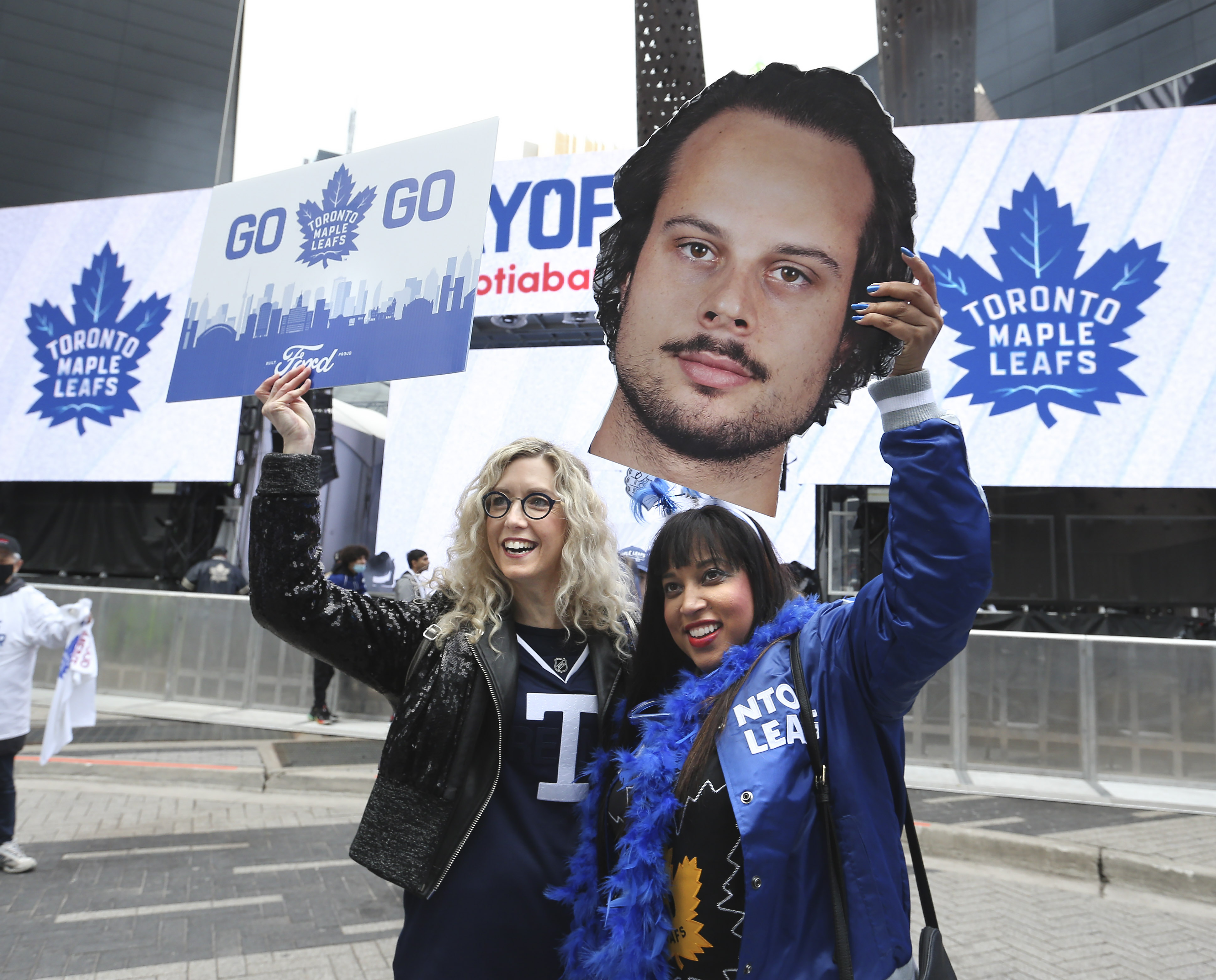 TORONTO, ON - May 2 Prior to the start of the game, fans begin to gather.  Sher (left-no last name) and Stephanie Scott (holding a photo of Auston Matthews) give a cheer in Maple Leaf Square.
The Toronto Maple Leafs took on the Tampa Bay Lightning in NHL hockey action at the Scotiabank Arena in Toronto.  This is the first game of the first round of playoffs
May 2 2022        (Richard Lautens/Toronto Star via Getty Images)