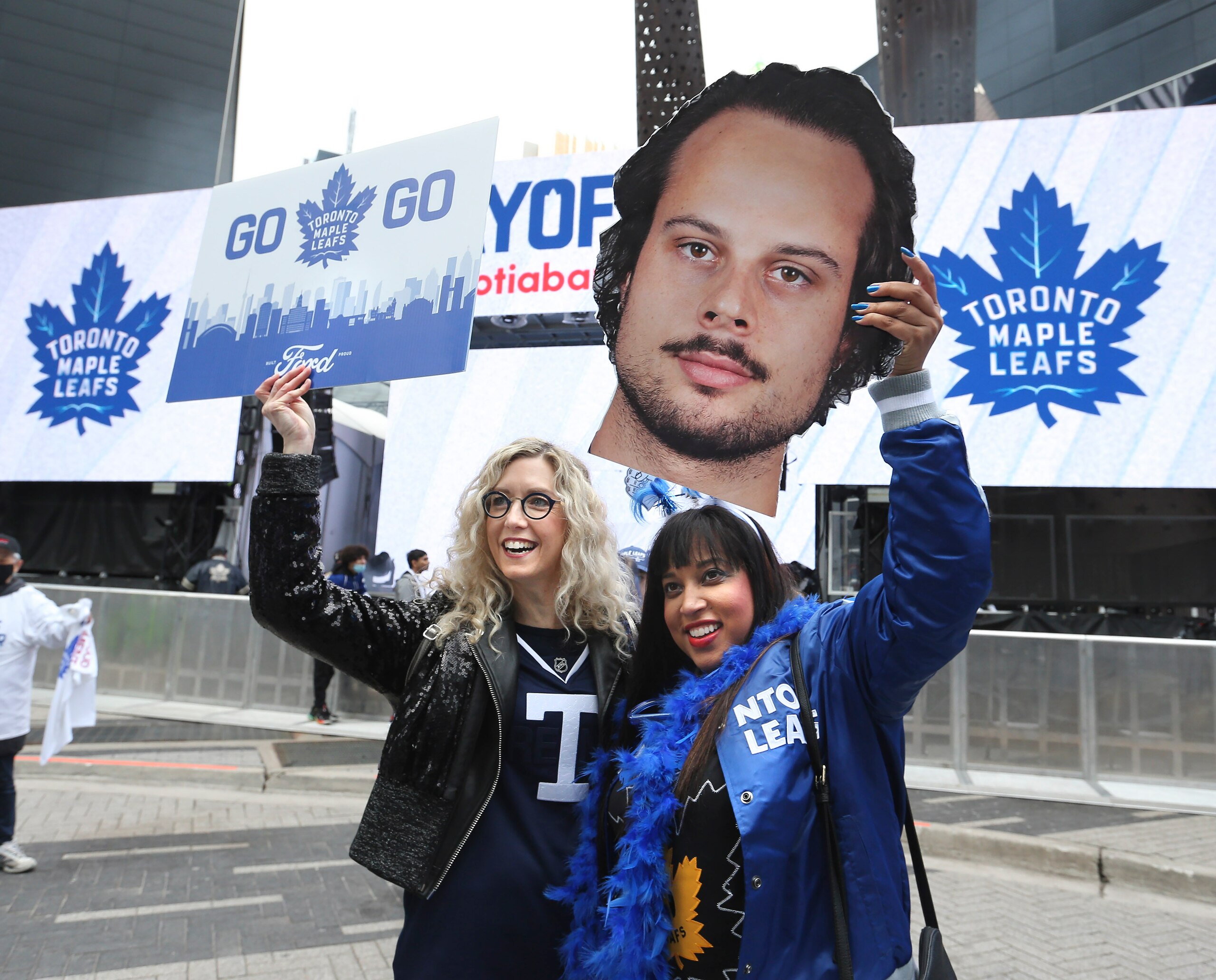 TORONTO, ON - May 2 Prior to the start of the game, fans begin to gather.  Sher (left-no last name) and Stephanie Scott (holding a photo of Auston Matthews) give a cheer in Maple Leaf Square.
The Toronto Maple Leafs took on the Tampa Bay Lightning in NHL hockey action at the Scotiabank Arena in Toronto.  This is the first game of the first round of playoffs
May 2 2022        (Richard Lautens/Toronto Star via Getty Images)