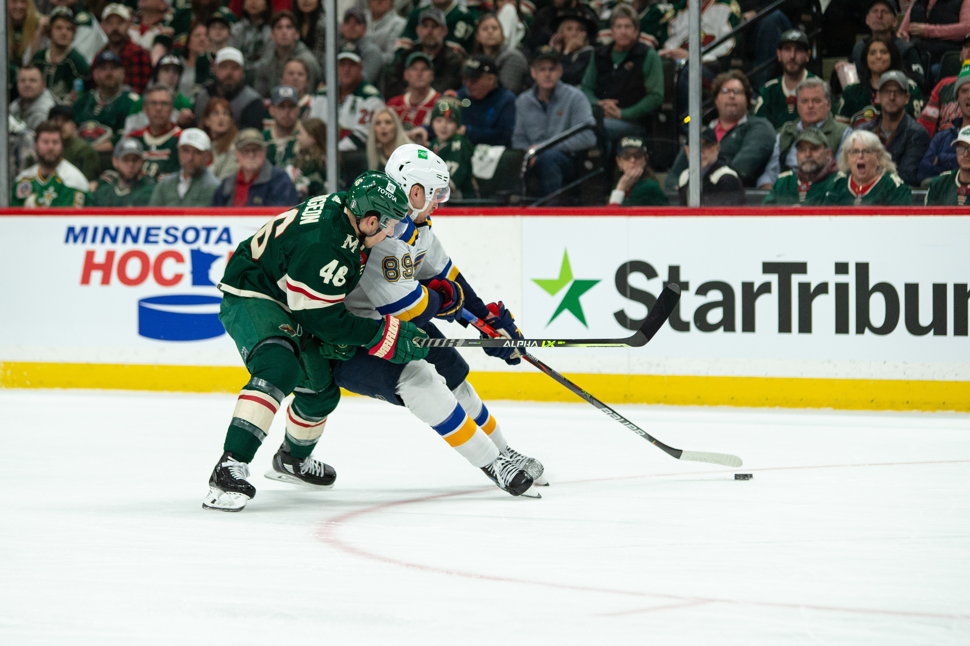 SAINT PAUL, MN - MAY 02: Minnesota Wild Defenceman Jared Spurgeon (46) attempts to bump St. Louis Blues Winger Pavel Buchnevich (89) off the puck during game 1 of the NHL playoffs between the St. Louis Blues and the Minnesota Wild on April May 2nd, 2022, at Xcel Energy Center in Saint Paul, MN. (Photo by Bailey Hillesheim/Icon Sportswire via Getty Images)