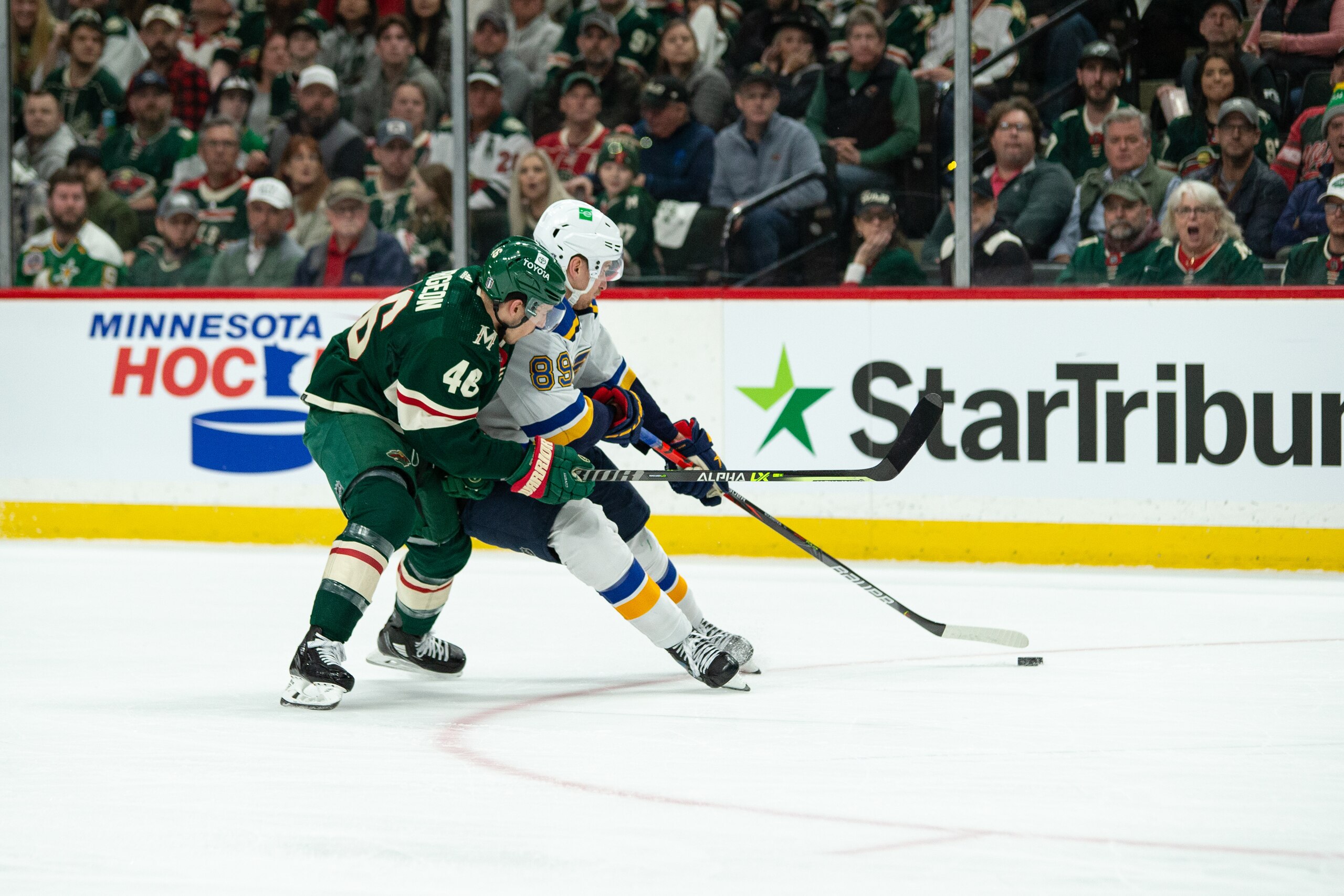 SAINT PAUL, MN - MAY 02: Minnesota Wild Defenceman Jared Spurgeon (46) attempts to bump St. Louis Blues Winger Pavel Buchnevich (89) off the puck during game 1 of the NHL playoffs between the St. Louis Blues and the Minnesota Wild on April May 2nd, 2022, at Xcel Energy Center in Saint Paul, MN. (Photo by Bailey Hillesheim/Icon Sportswire via Getty Images)