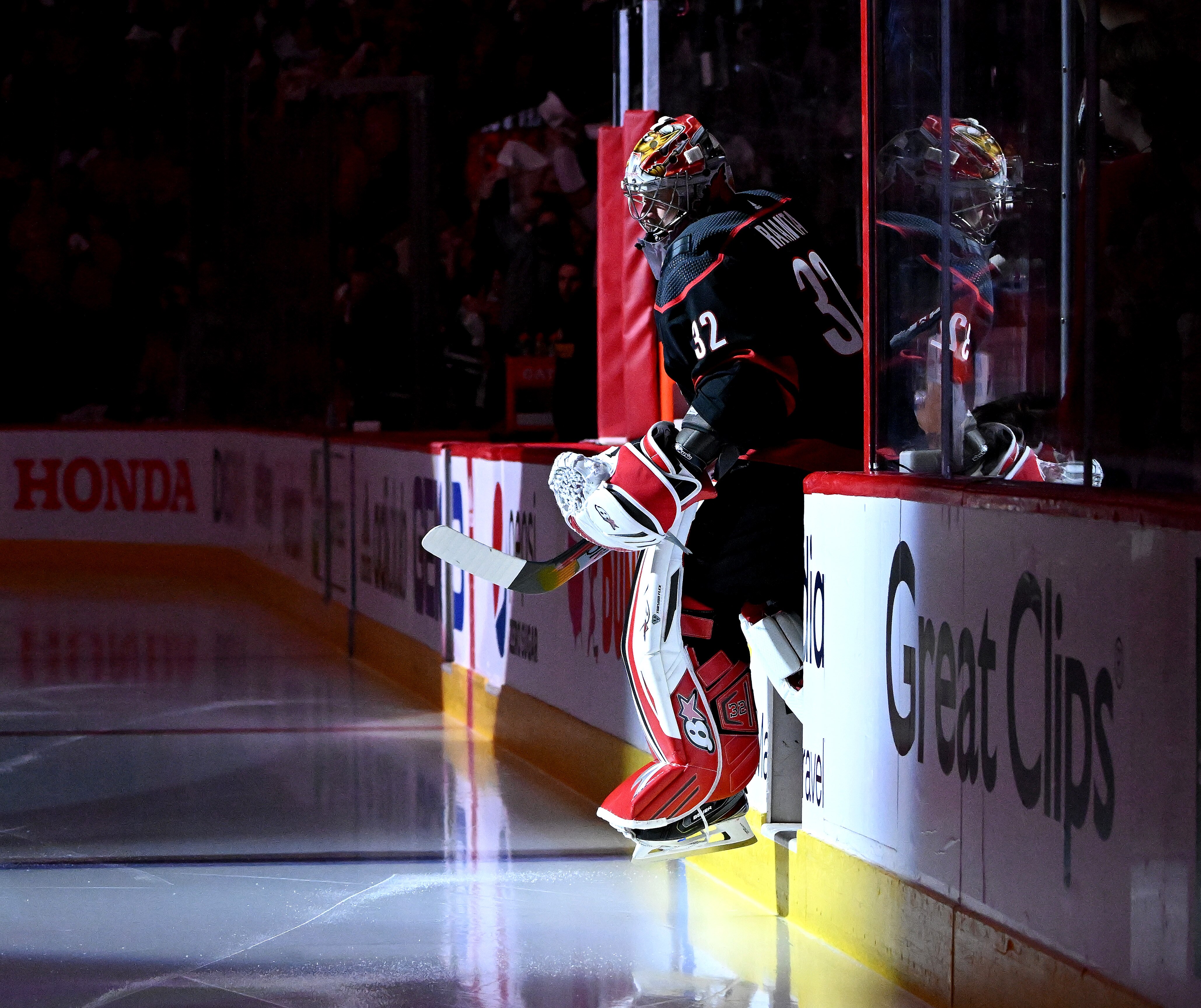 RALEIGH, NORTH CAROLINA - MAY 02: Antti Raanta #32 of the Carolina Hurricanes leads his team onto the ice against the Boston Bruins during Game One of the First Round of the 2022 Stanley Cup Playoffs at PNC Arena on May 02, 2022 in Raleigh, North Carolina. (Photo by Grant Halverson/Getty Images)