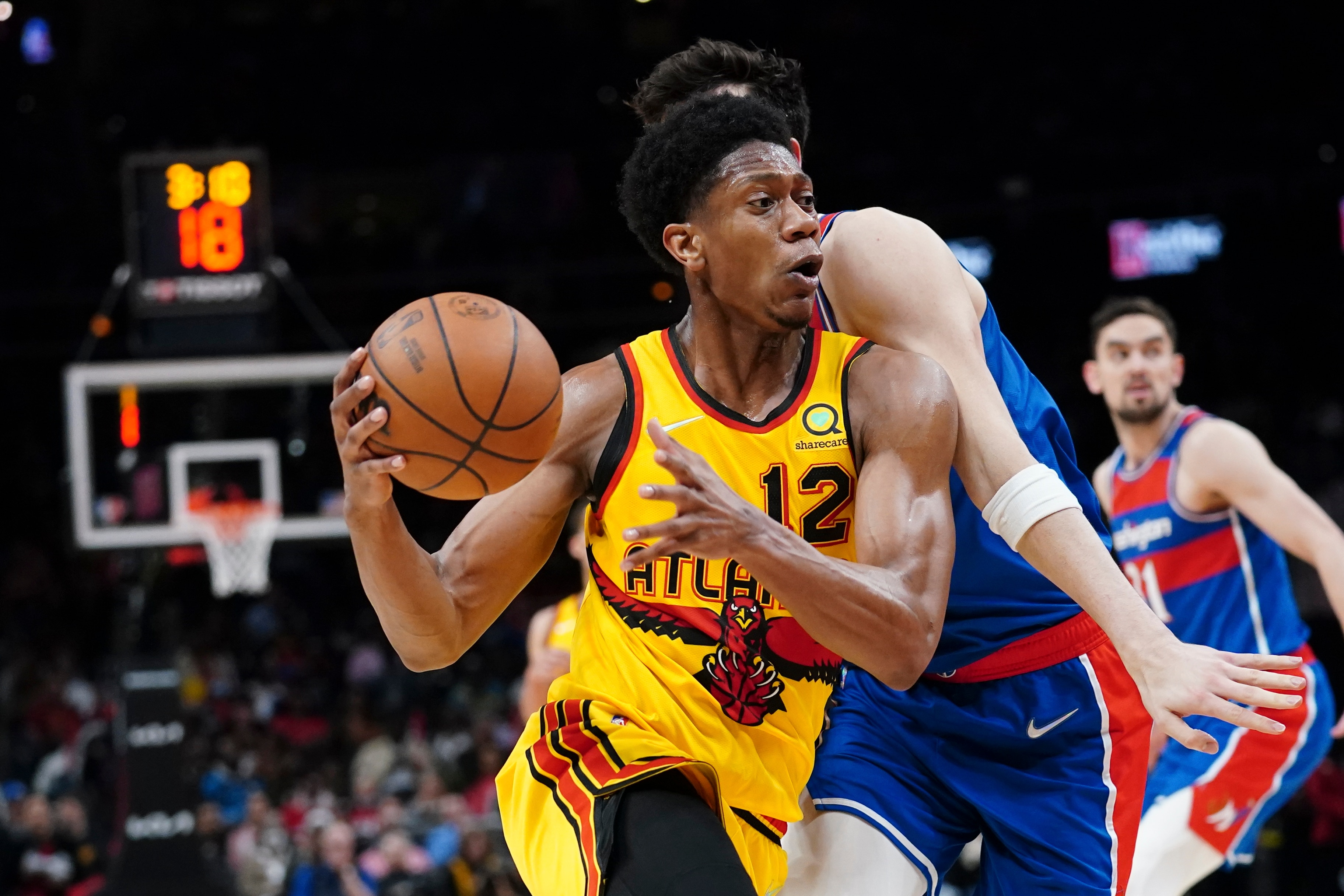 Atlanta Hawks forward De'Andre Hunter (12) is shown against the Washington Wizards during the first half of an NBA basketball gameWednesday, April 6, 2022, in Atlanta. (AP Photo/John Bazemore)