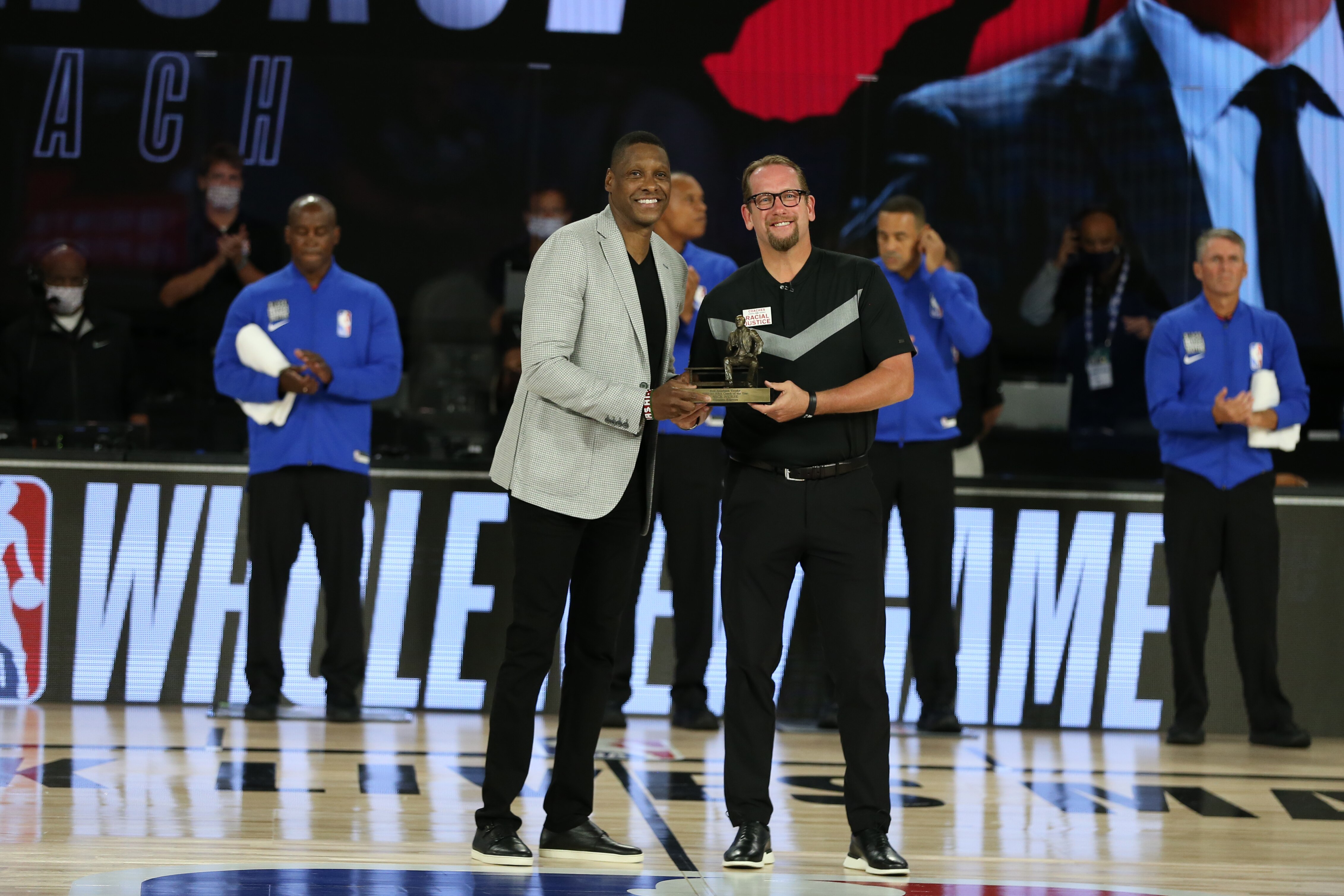 ORLANDO, FL - AUGUST 23: President of the Toronto Raptors, Masai Ujiri presents the 2019-2020 Coach of the Year Award to Head Coach, Nick Nurse of the Toronto Raptors before the game against the Brooklyn Nets during Round One, Game Four of the NBA Playoffs on August 23, 2020 at the The Field House at ESPN Wide World Of Sports Complex in Orlando, Florida. NOTE TO USER: User expressly acknowledges and agrees that, by downloading and/or using this Photograph, user is consenting to the terms and conditions of the Getty Images License Agreement. Mandatory Copyright Notice: Copyright 2020 NBAE (Photo by David Sherman/NBAE via Getty Images)