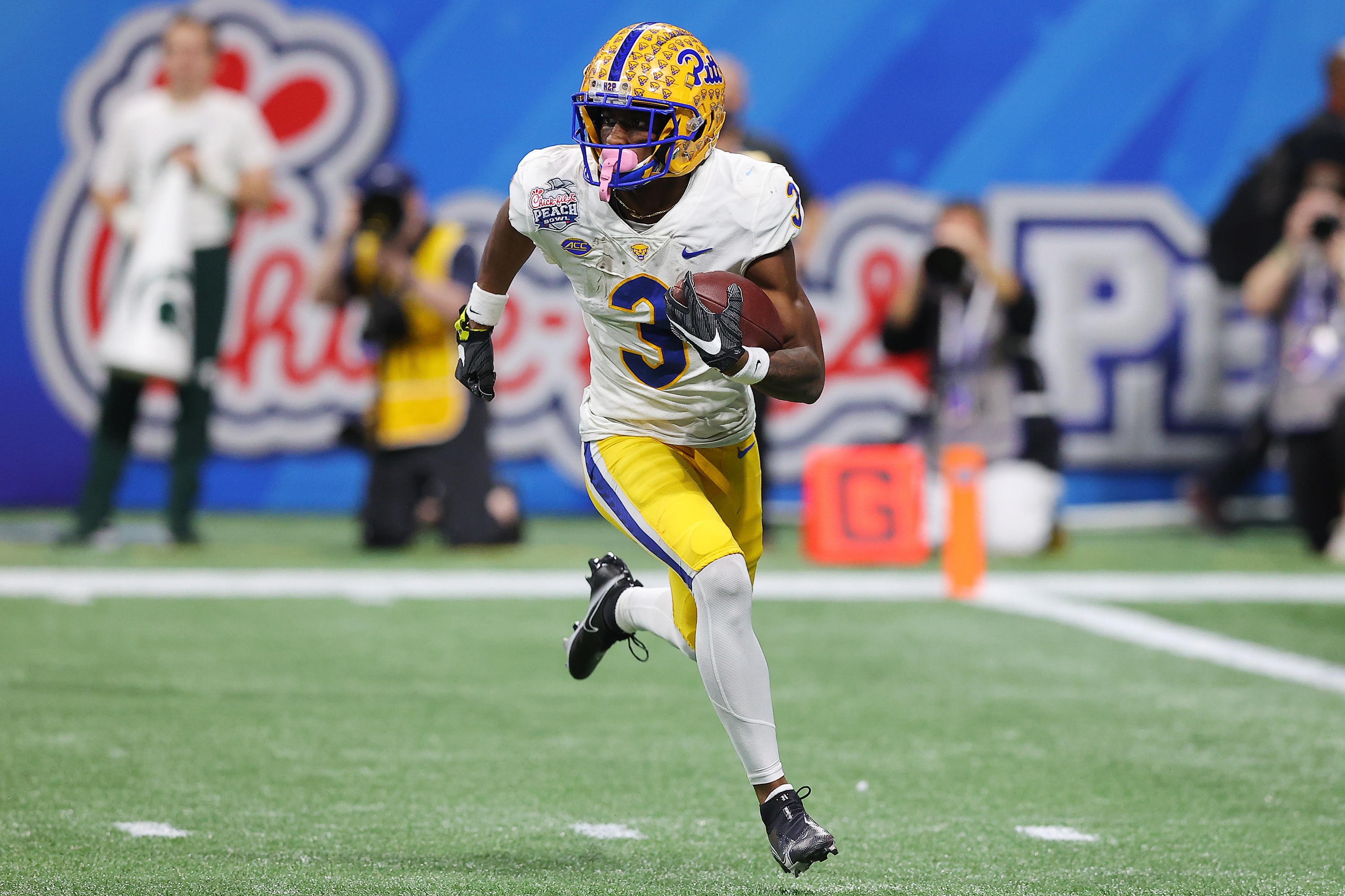 ATLANTA, GEORGIA - DECEMBER 30: Jordan Addison #3 of the Pittsburgh Panthers rushes with the ball during the third quarter against the Michigan State Spartans during the Chick-Fil-A Peach Bowl at Mercedes-Benz Stadium on December 30, 2021 in Atlanta, Georgia. (Photo by Todd Kirkland/Getty Images)