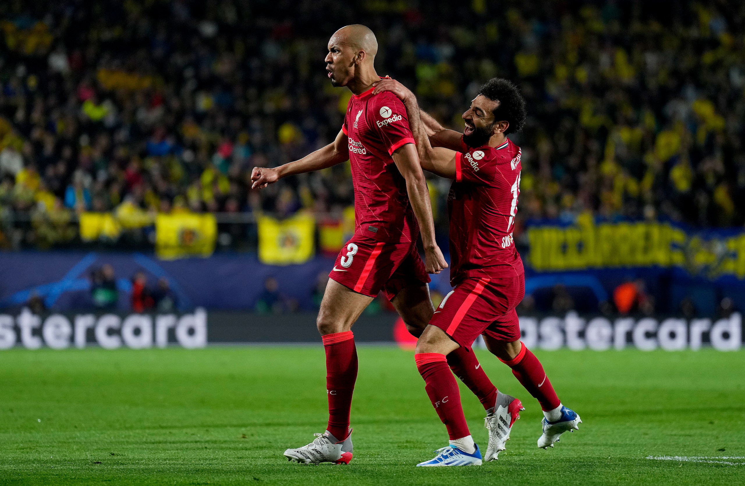 VILLARREAL, SPAIN - MAY 03: Fabinho celebrates with Mohamed Salah of Liverpool after scoring their team's first goal during the UEFA Champions League Semi Final Leg Two match between Villarreal and Liverpool at Estadio de la Ceramica on May 03, 2022 in Villarreal, Spain. (Photo by Aitor Alcalde - UEFA/UEFA via Getty Images) VILLARREAL, SPAIN - MAY 03: Fabinho celebrates with Mohamed Salah of Liverpool after scoring their team's first goal during the UEFA Champions League Semi Final Leg Two match between Villarreal and Liverpool at Estadio de la Ceramica on May 03, 2022 in Villarreal, Spain. (Photo by Aitor Alcalde - UEFA/UEFA via Getty Images)