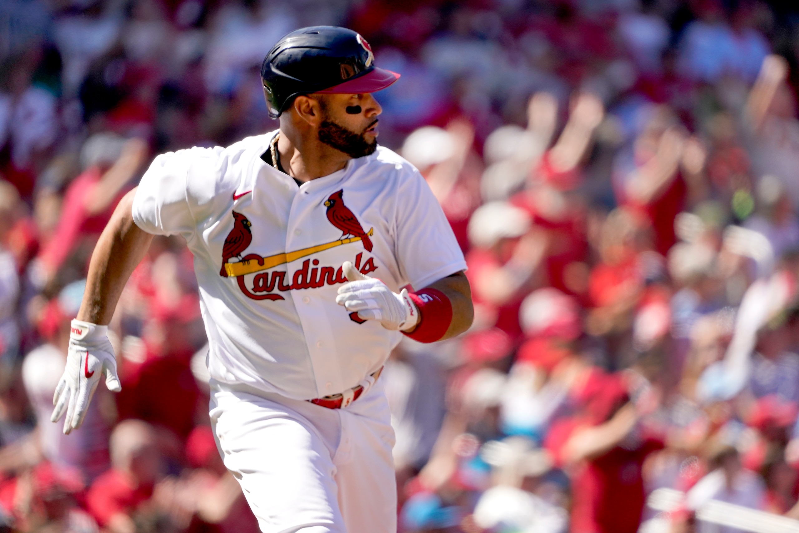 St. Louis Cardinals' Albert Pujols heads to first for an RBI single during the sixth inning of a baseball game against the Arizona Diamondbacks Sunday, May 1, 2022, in St. Louis. (AP Photo/Jeff Roberson)