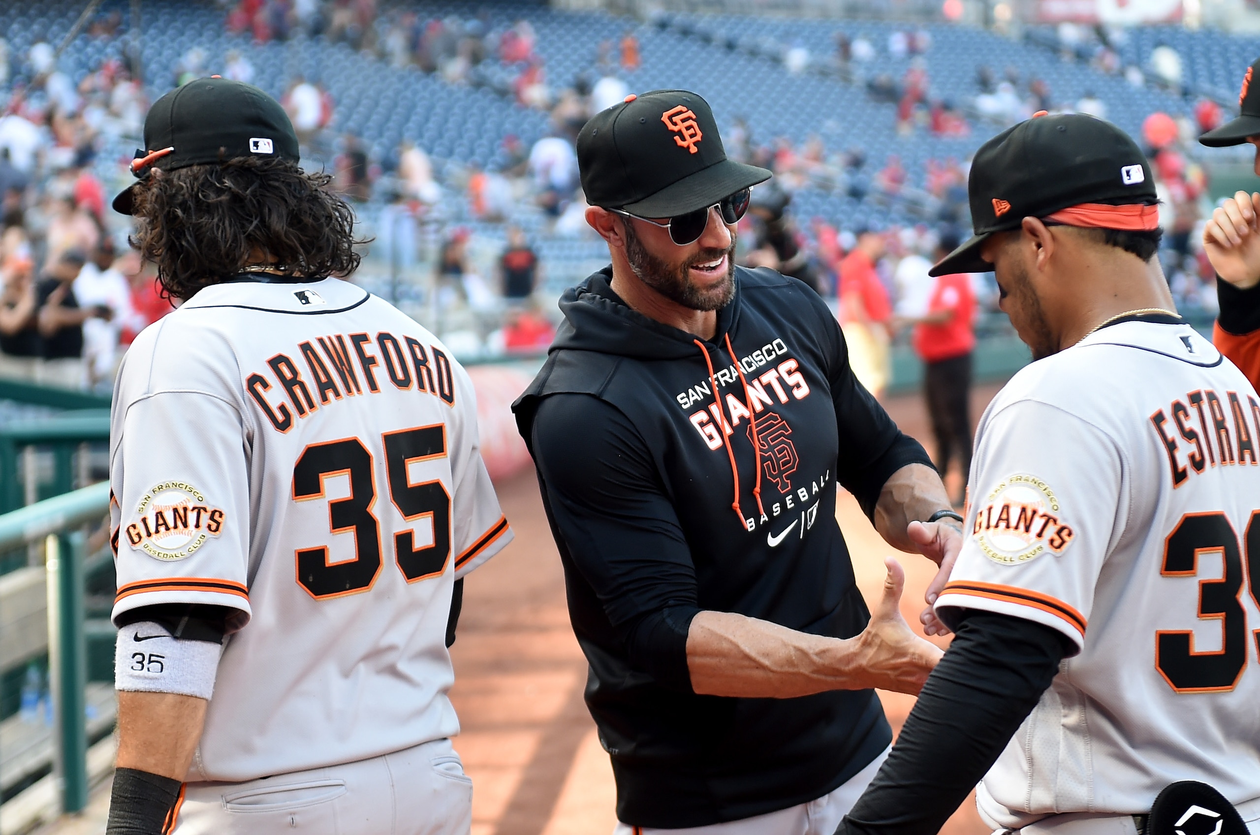 WASHINGTON, DC - APRIL 24: Manager Gabe Kapler #19 of the San Francisco Giants celebrates with Thairo Estrada #39 after a 12-3 victory against the Washington Nationals at Nationals Park on April 24, 2022 in Washington, DC. (Photo by G Fiume/Getty Images)