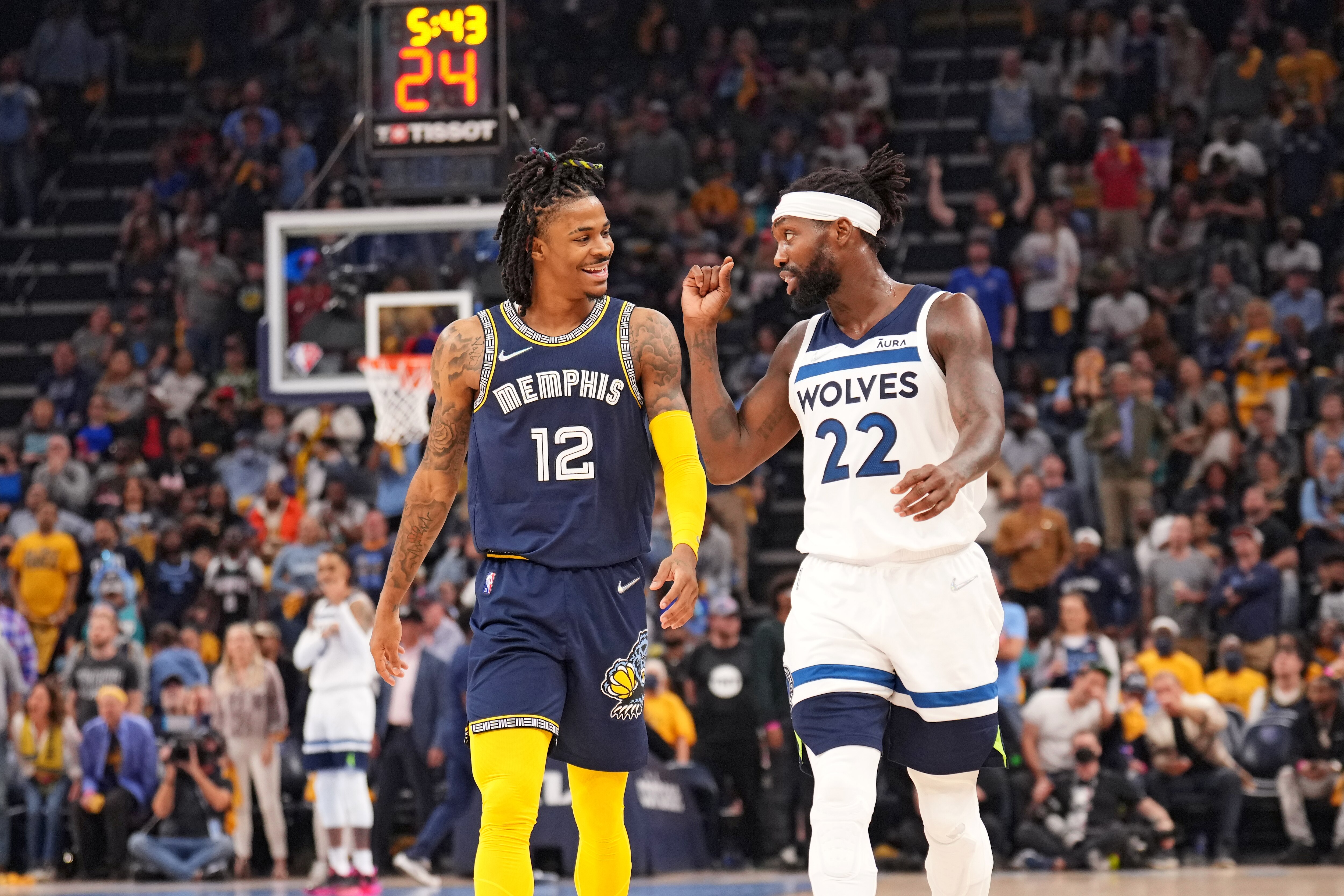 MEMPHIS, TN - APRIL 26: Ja Morant #12 of the Memphis Grizzlies and Patrick Beverley #22 of the Minnesota Timberwolves smiles during Round 1 Game 5 on April 26, 2022 at FedExForum in Memphis, Tennessee. NOTE TO USER: User expressly acknowledges and agrees that, by downloading and/or using this Photograph, user is consenting to the terms and conditions of the Getty Images License Agreement. Mandatory Copyright Notice: Copyright 2022 NBAE (Photo by Jesse D. Garrabrant/NBAE via Getty Images)