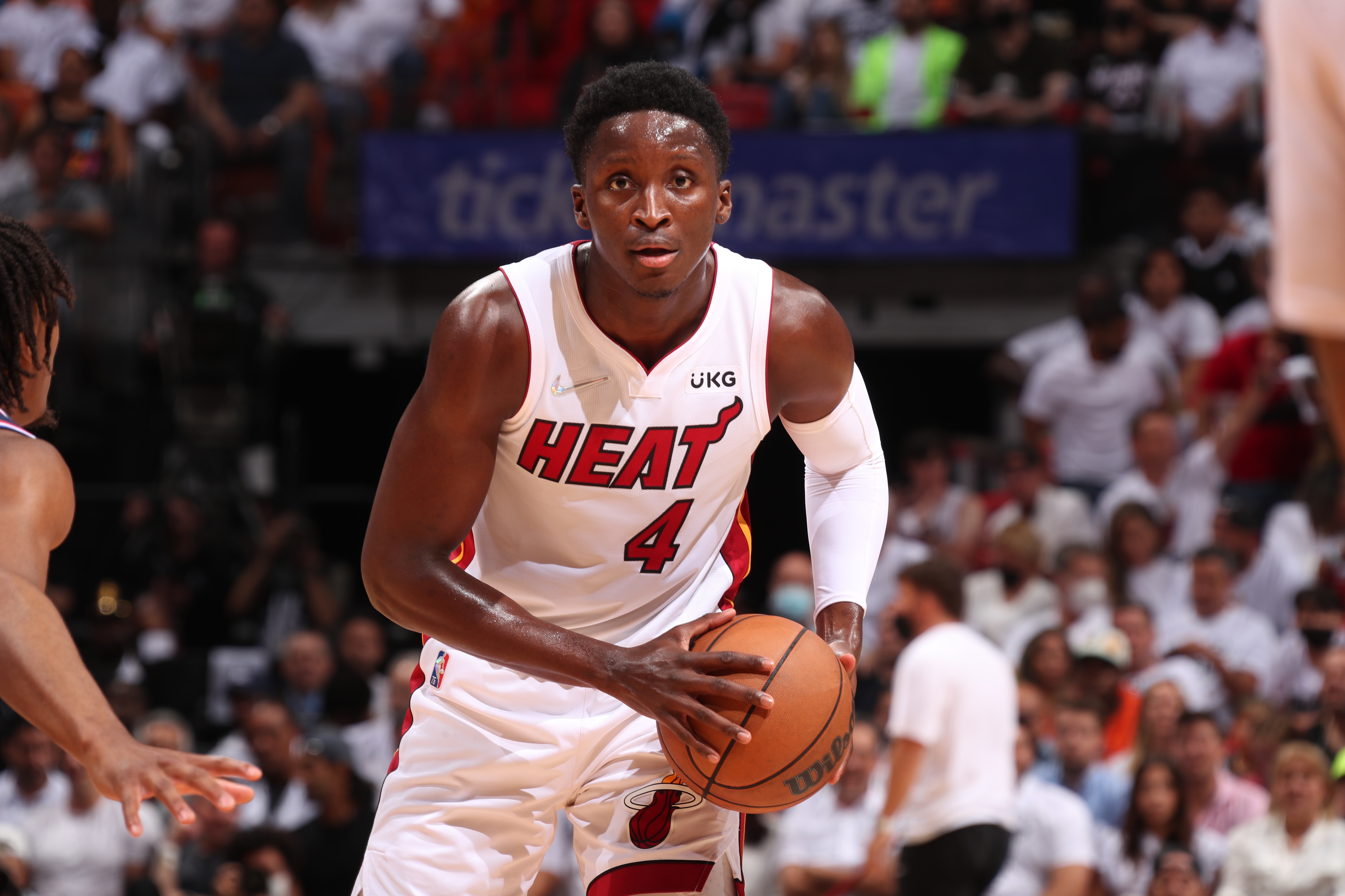 MIAMI, FL - MAY 2: Victor Oladipo #4 of the Miami Heat looks to pass the ball against the Philadelphia 76ers during Game 1 of the 2022 NBA Playoffs Eastern Conference Semifinals on May 2, 2022 at FTX Arena in Miami, Florida. NOTE TO USER: User expressly acknowledges and agrees that, by downloading and or using this Photograph, user is consenting to the terms and conditions of the Getty Images License Agreement. Mandatory Copyright Notice: Copyright 2022 NBAE (Photo by Issac Baldizon/NBAE via Getty Images)