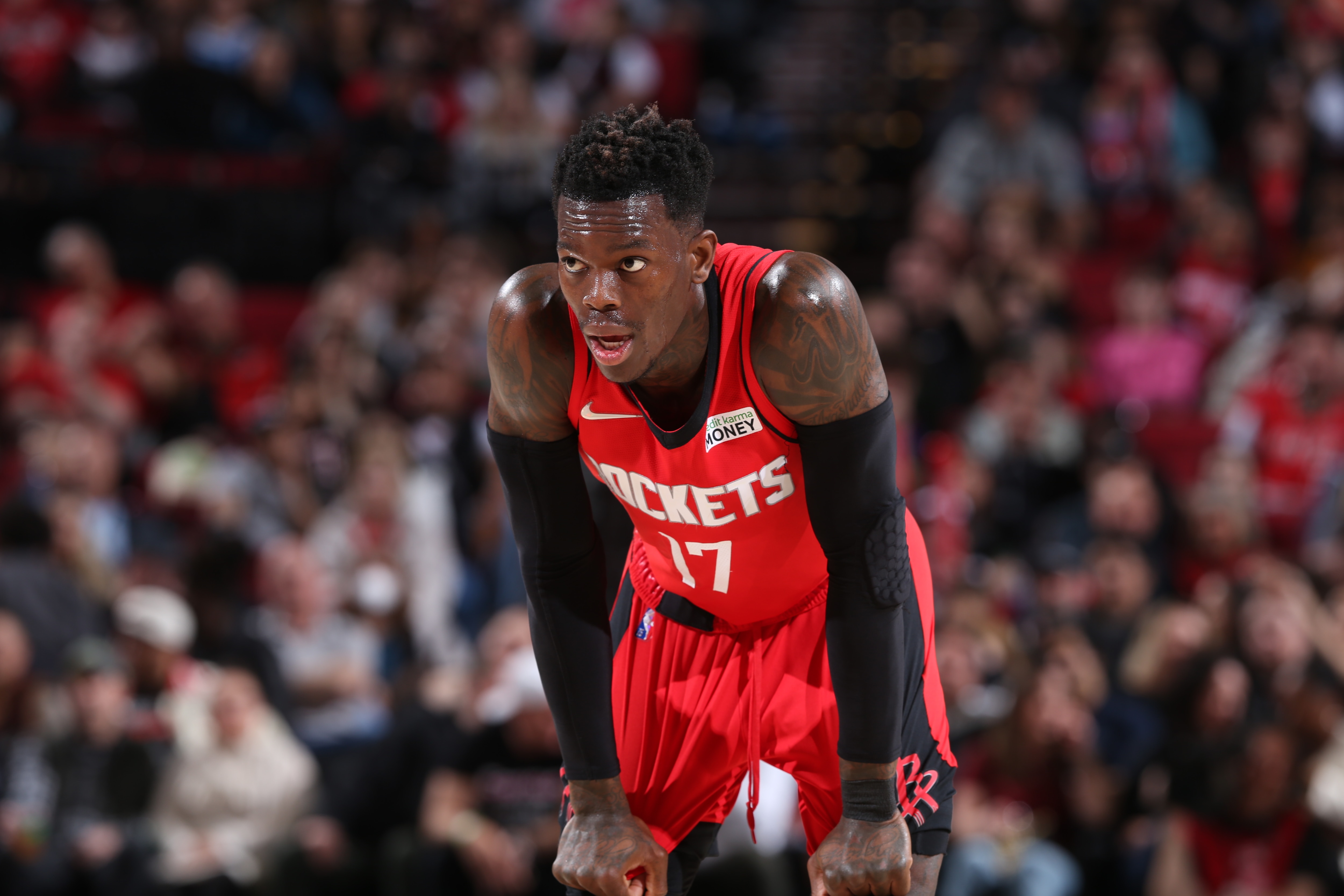 PORTLAND, OR - MARCH 26: Dennis Schroder #17 of the Houston Rockets looks on during the game against the Portland Trail Blazers on March 26, 2022 at the Moda Center Arena in Portland, Oregon. NOTE TO USER: User expressly acknowledges and agrees that, by downloading and or using this photograph, user is consenting to the terms and conditions of the Getty Images License Agreement. Mandatory Copyright Notice: Copyright 2022 NBAE (Photo by Sam Forencich/NBAE via Getty Images)