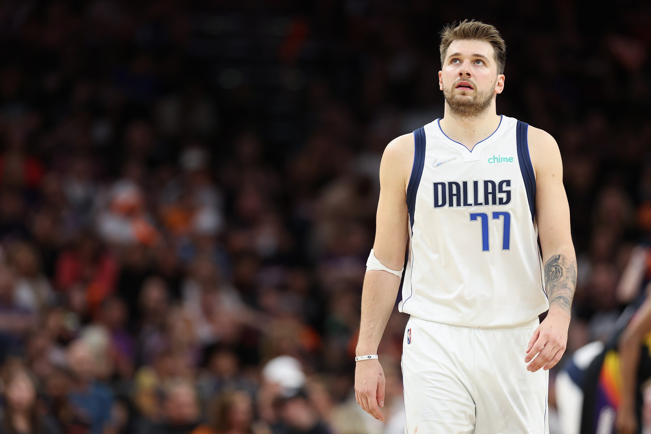 PHOENIX, ARIZONA - MAY 04: Luka Doncic #77 of the Dallas Mavericks reacts during the second half of Game Two of the Western Conference Second Round NBA Playoffs against the Phoenix Suns at Footprint Center on May 04, 2022 in Phoenix, Arizona.  The Suns defeated the Mavericks 129-109. NOTE TO USER: User expressly acknowledges and agrees that, by downloading and or using this photograph, User is consenting to the terms and conditions of the Getty Images License Agreement. (Photo by Christian Petersen/Getty Images)