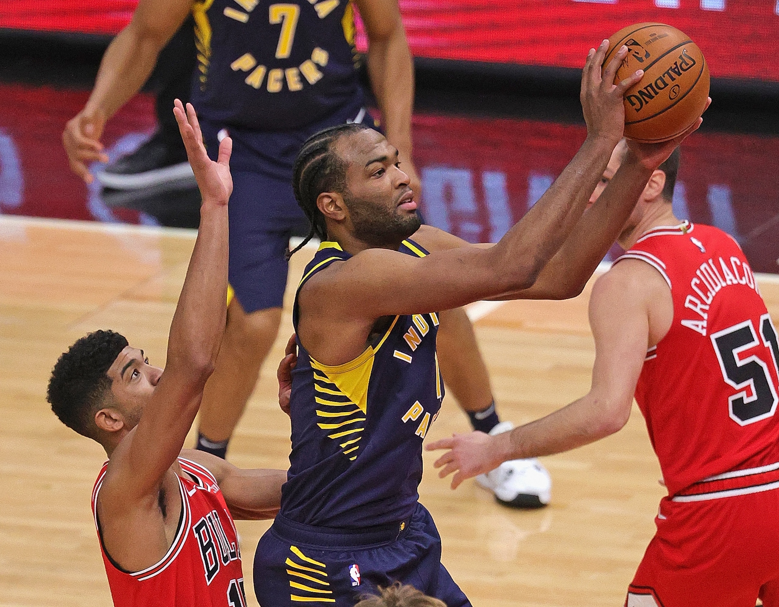 CHICAGO, ILLINOIS - DECEMBER 26: T.J. Warren #1 of the Indiana Pacers shoots over Chandler Hutchison #15 of the Chicago Bulls at the United Center on December 26, 2020 in Chicago, Illinois. The Pacers defeated the Bulls 125-106. NOTE TO USER: User expressly acknowledges and agrees that, by downloading and or using this photograph, User is consenting to the terms and conditions of the Getty Images License Agreement. (Photo by Jonathan Daniel/Getty Images)