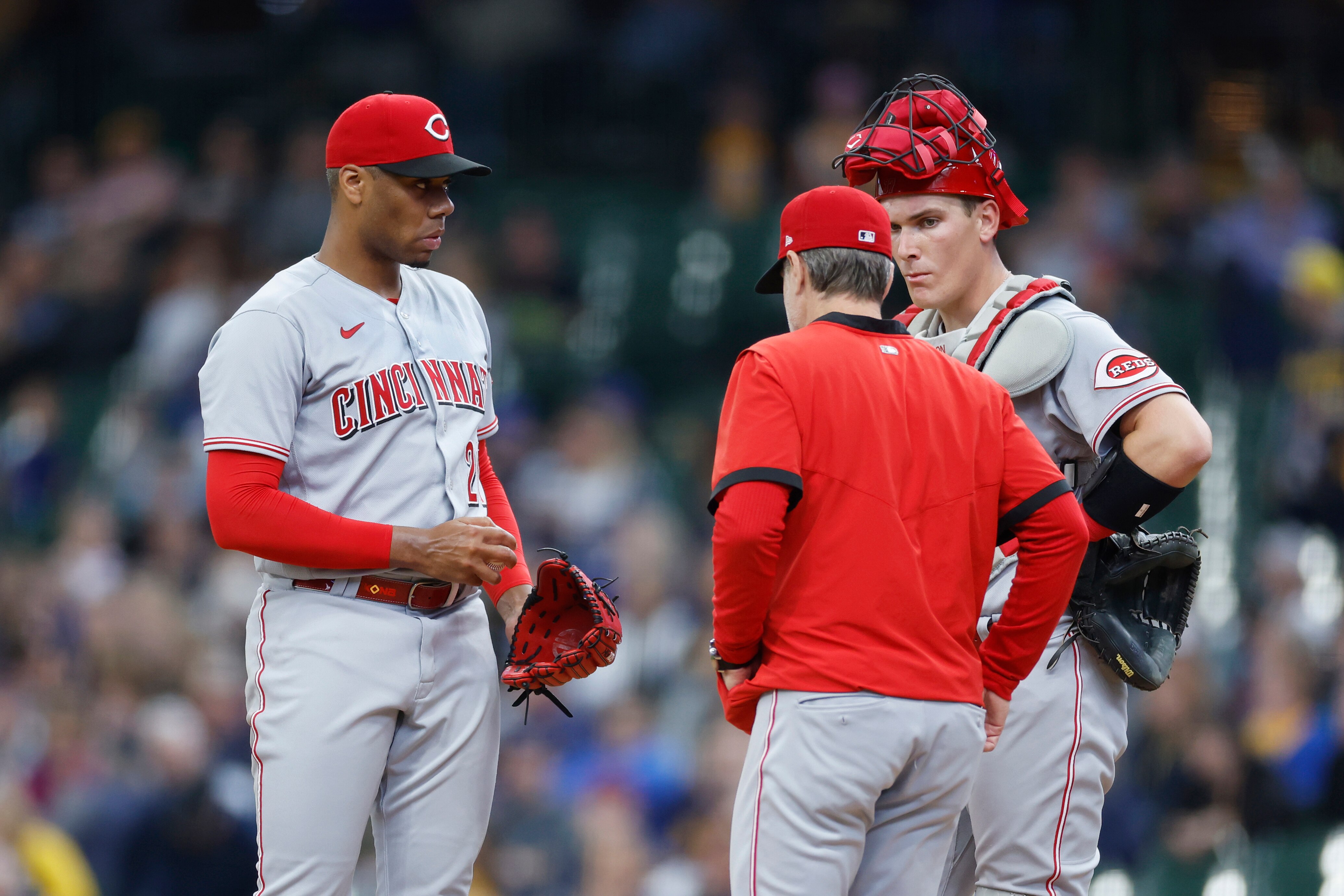 MILWAUKEE, WI - MAY 05: Cincinnati Reds starting pitcher Hunter Greene (21) talks to manager David Bell and catcher Tyler Stephenson (37) before being taken out of the MLB game against the Milwaukee Brewers on May 5, 2022 at American Family Field in Milwaukee, Wisconsin. (Photo by Joe Robbins/Icon Sportswire via Getty Images)