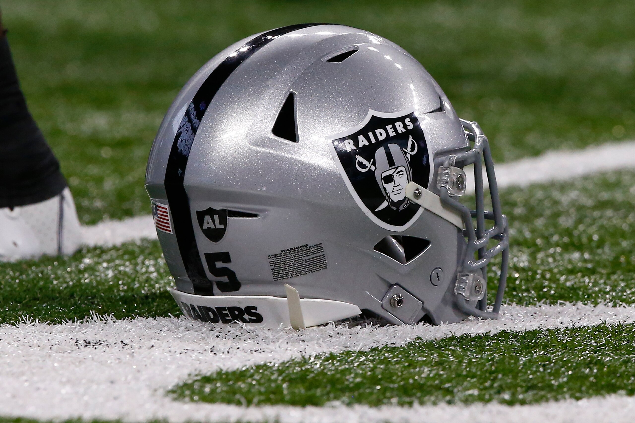 INDIANAPOLIS, IN - JANUARY 02: A Las Vegas Raiders helmet sits on the turf during an NFL game between the Las Vegas Raiders and the Indianapolis Colts on January 02, 2022 at Lucas Oil Stadium in Indianapolis, IN. (Photo by Jeffrey Brown/Icon Sportswire via Getty Images) INDIANAPOLIS, IN - JANUARY 02: A Las Vegas Raiders helmet sits on the turf during an NFL game between the Las Vegas Raiders and the Indianapolis Colts on January 02, 2022 at Lucas Oil Stadium in Indianapolis, IN. (Photo by Jeffrey Brown/Icon Sportswire via Getty Images)