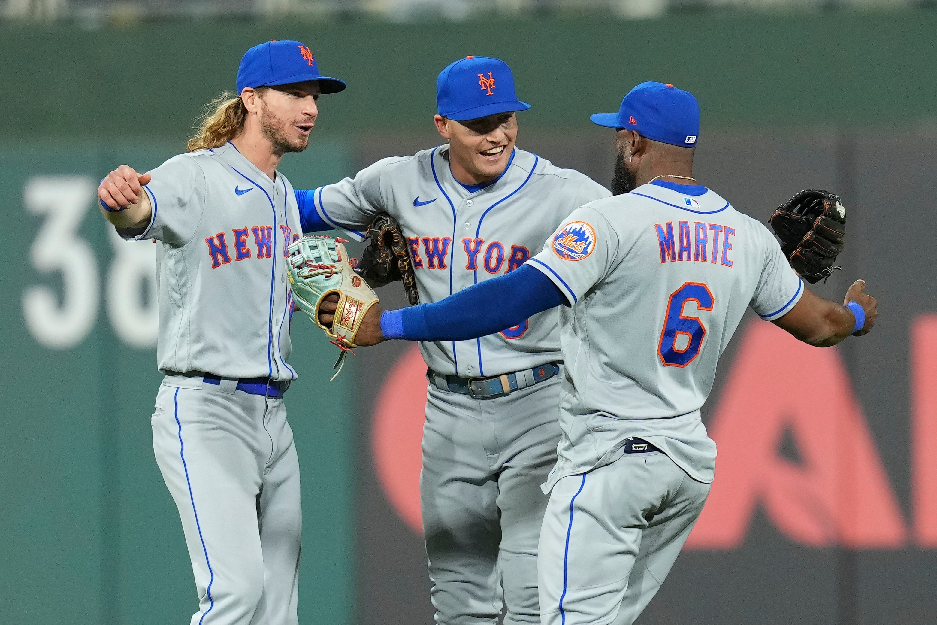 PHILADELPHIA, PA - MAY 05: Travis Jankowski #16, Brandon Nimmo #9, and Starling Marte #6 of the New York Mets celebrate their win against the Philadelphia Phillies at Citizens Bank Park on May 5, 2022 in Philadelphia, Pennsylvania. The Mets defeated the Phillies 8-7. (Photo by Mitchell Leff/Getty Images)