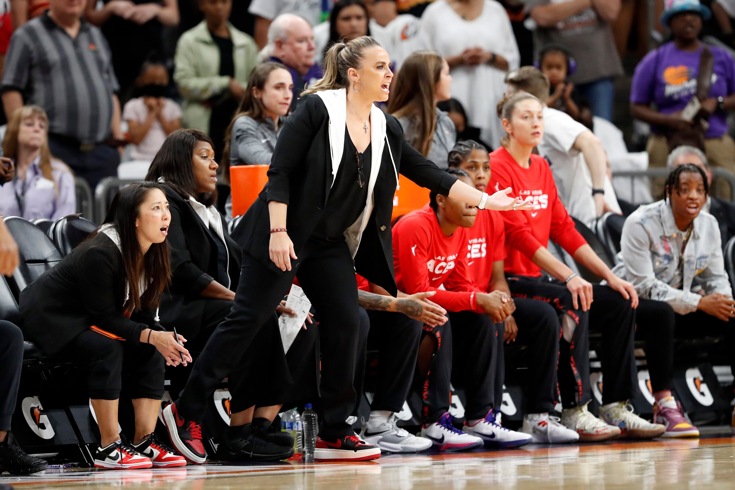 PHOENIX, ARIZONA - MAY 06: Head coach Becky Hammon of the Las Vegas Aces gestures during the first quarter against the Phoenix Mercury at Footprint Center on May 06, 2022 in Phoenix, Arizona. NOTE TO USER: User expressly acknowledges and agrees that, by downloading and or using this photograph, User is consenting to the terms and conditions of the Getty Images License Agreement. (Photo by Chris Coduto/Getty Images)