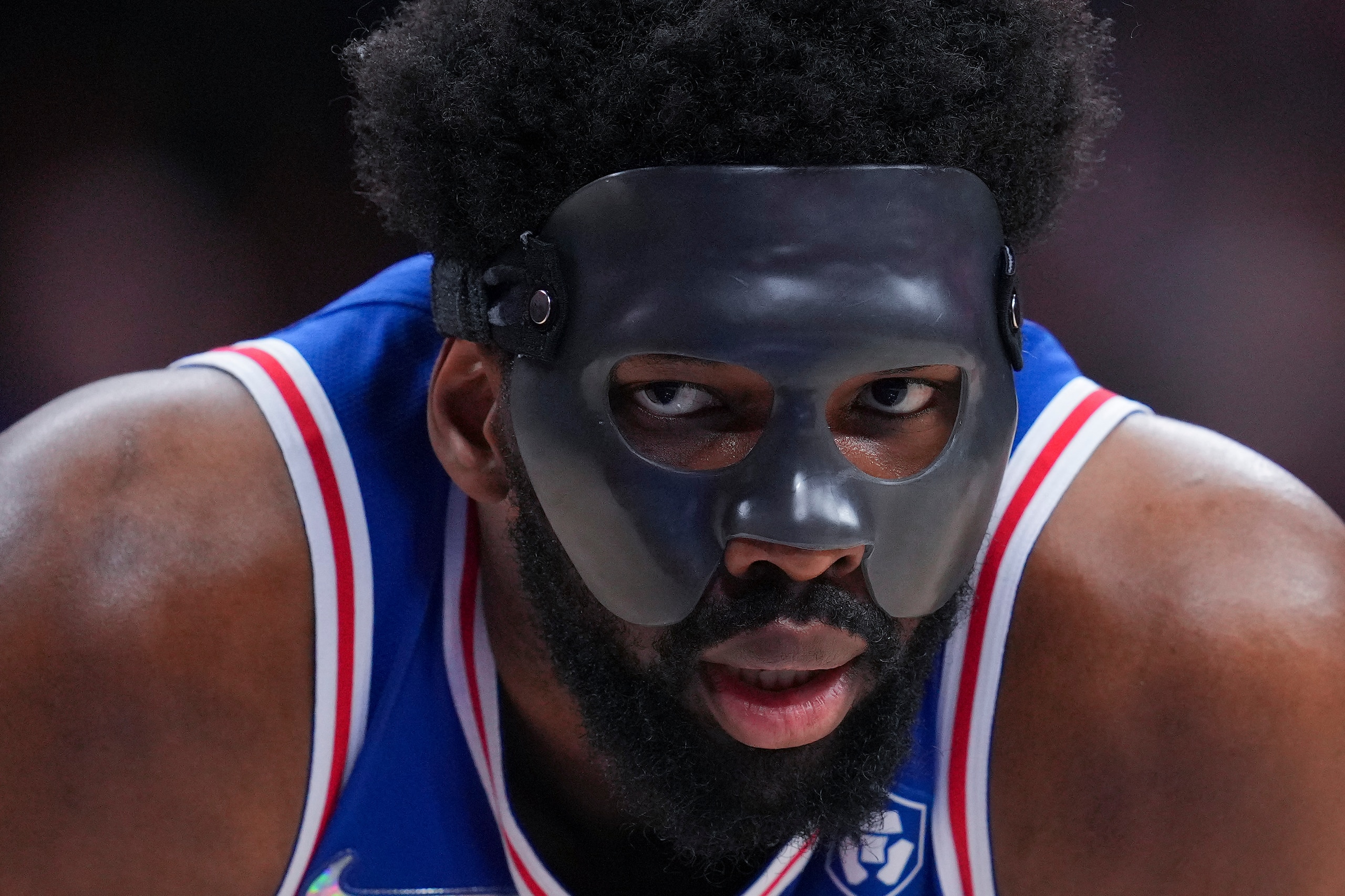 PHILADELPHIA, PA - MAY 06: Joel Embiid #21 of the Philadelphia 76ers looks on with his protective face guard against the Miami Heat during Game Three of the 2022 NBA Playoffs Eastern Conference Semifinals at the Wells Fargo Center on May 6, 2022 in Philadelphia, Pennsylvania. The 76ers defeated the Heat 99-79. NOTE TO USER: User expressly acknowledges and agrees that, by downloading and or using this photograph, User is consenting to the terms and conditions of the Getty Images License Agreement. (Photo by Mitchell Leff/Getty Images)