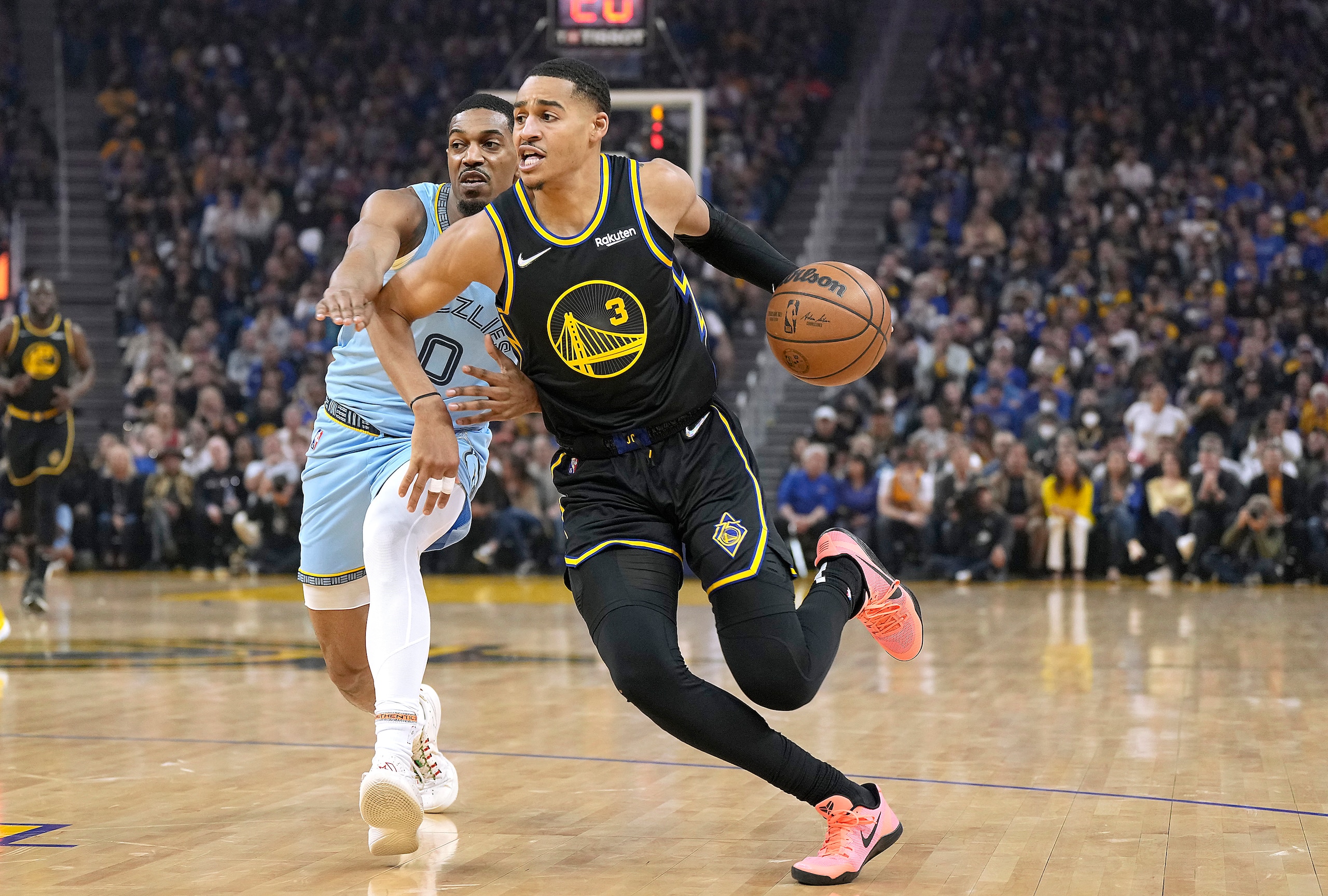 SAN FRANCISCO, CALIFORNIA - MAY 07: Jordan Poole #3 of the Golden State Warriors drives to the basket on De'Anthony Melton #0 of the Memphis Grizzlies during the first half of Game Three of the Western Conference Semifinals of the NBA Playoffs at Chase Center on May 07, 2022 in San Francisco, California. NOTE TO USER: User expressly acknowledges and agrees that, by downloading and or using this photograph, User is consenting to the terms and conditions of the Getty Images License Agreement. (Photo by Thearon W. Henderson/Getty Images)