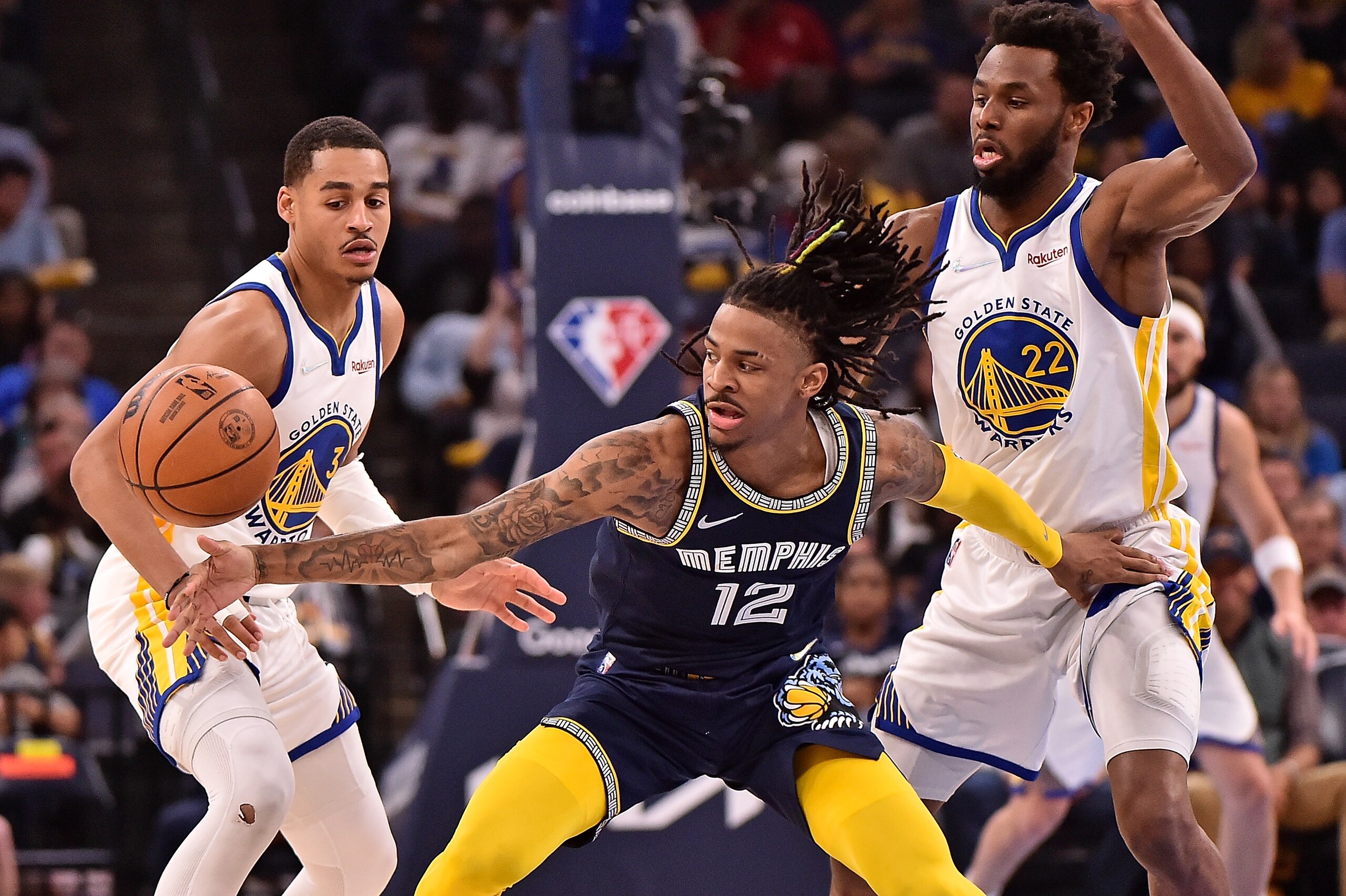 MEMPHIS, TENNESSEE - MAY 03: Ja Morant #12 of the Memphis Grizzlies handles the ball against Jordan Poole #3 of the Golden State Warriors during Game Two of the Western Conference Semifinals of the NBA Playoffs at FedExForum on May 03, 2022 in Memphis, Tennessee. NOTE TO USER: User expressly acknowledges and agrees that, by downloading and or using this photograph, User is consenting to the terms and conditions of the Getty Images License Agreement. (Photo by Justin Ford/Getty Images)