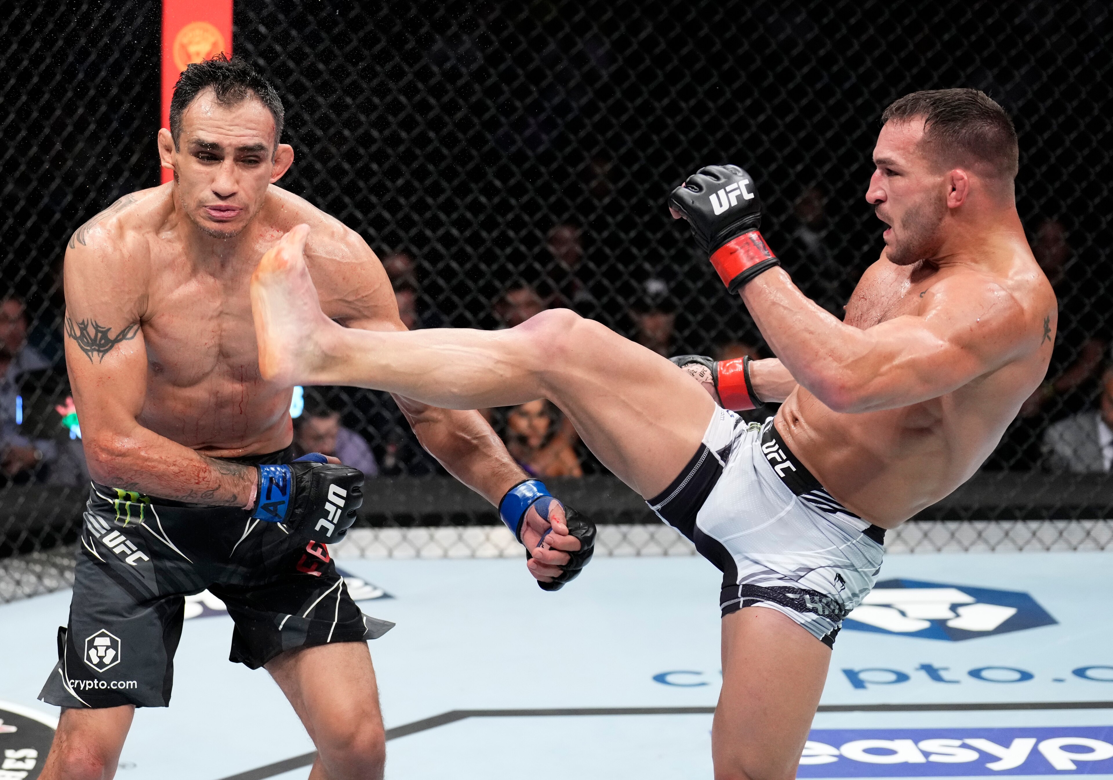 PHOENIX, ARIZONA - MAY 07: (R-L) Michael Chandler knocks out Tony Ferguson in a lightweight fight during the UFC 274 event at Footprint Center on May 07, 2022 in Phoenix, Arizona. (Photo by Chris Unger/Zuffa LLC)