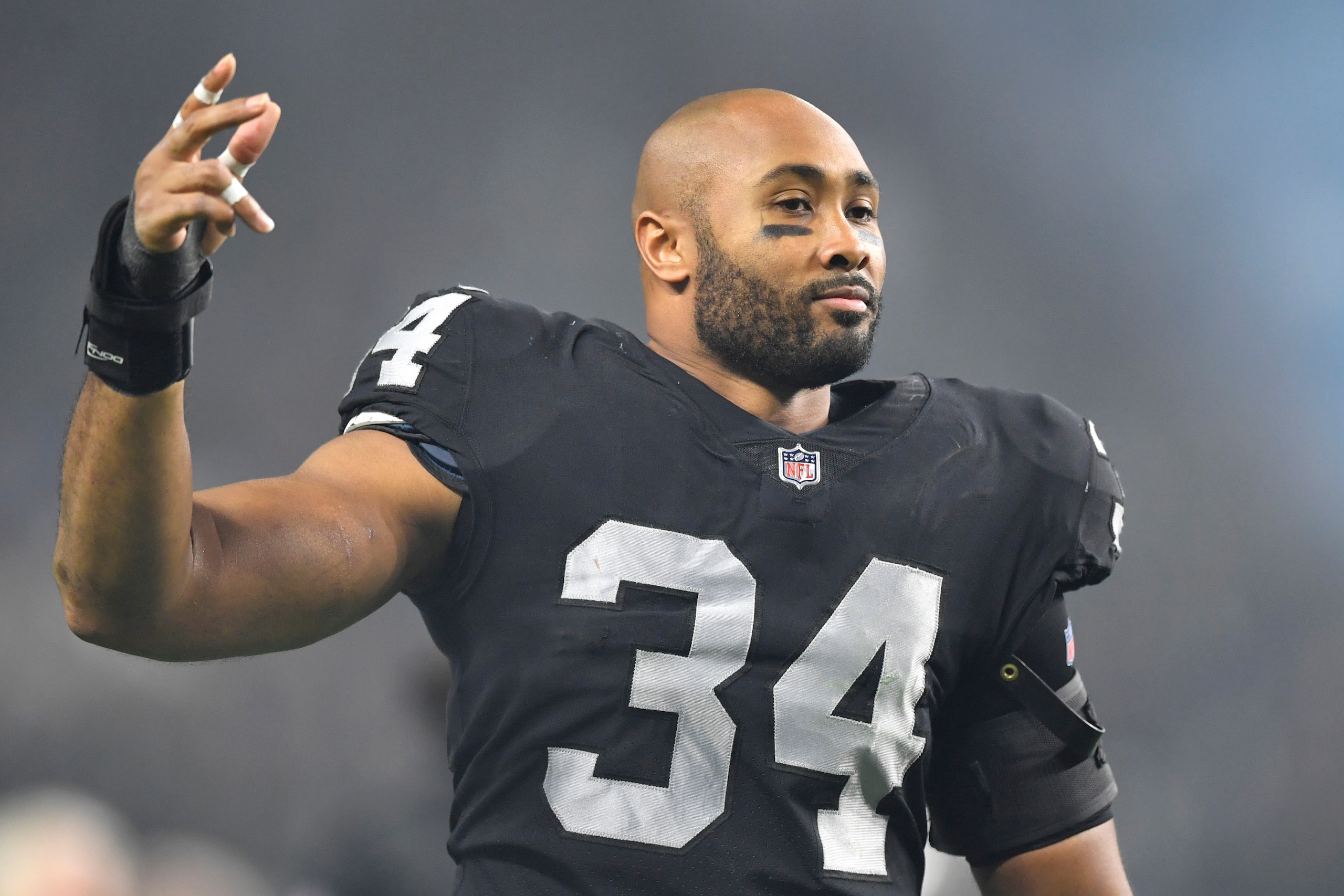 LAS VEGAS, NEVADA - JANUARY 09:  Outside linebacker K.J. Wright #34 of the Las Vegas Raiders runs off the field after the team's 35-32 overtime victory over the Los Angeles Chargers at Allegiant Stadium on January 09, 2022 in Las Vegas, Nevada. (Photo by Chris Unger/Getty Images)
