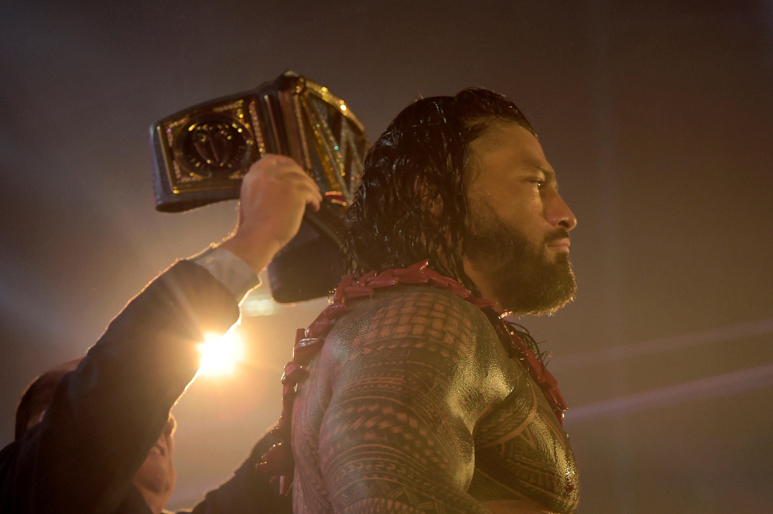 Roman Reigns wins a match during the 2022 WWE Elimination Chamber at the Jeddah Super Dome in Saudi Arabia's Red Sea coastal city of Jeddah on February 19, 2022. (Photo by Amer HILABI / AFP) (Photo by AMER HILABI/AFP via Getty Images)