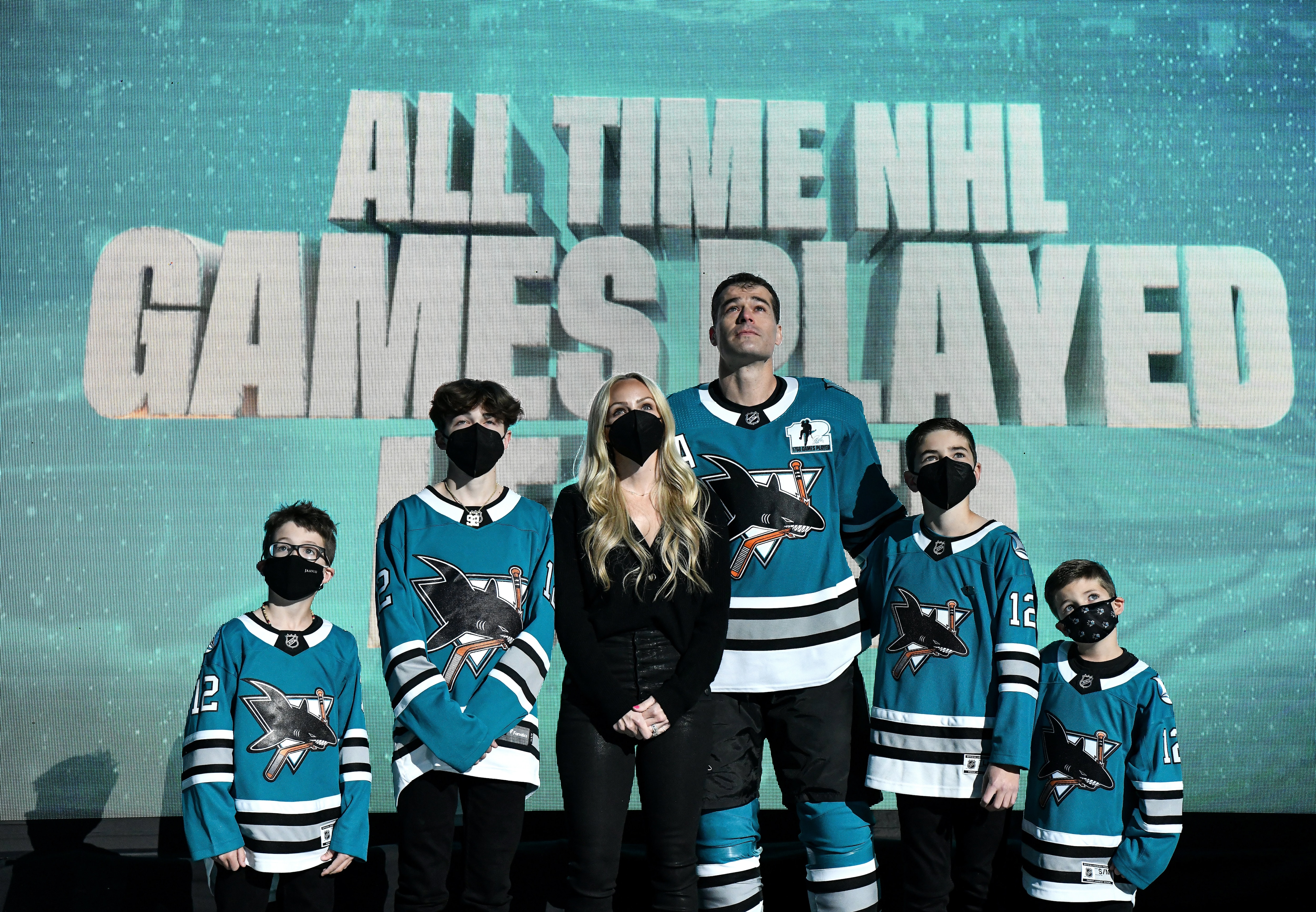 SAN JOSE, CA - APRIL 24: Patrick Marleau #12 of the San Jose Sharks and his family look up at the video board as he is honored for having passed Gordie Howe on the NHLs all-time games played list before the game against the Minnesota Wild at SAP Center on April 24, 2021 in San Jose, California. (Photo by Brandon Magnus/NHLI via Getty Images)