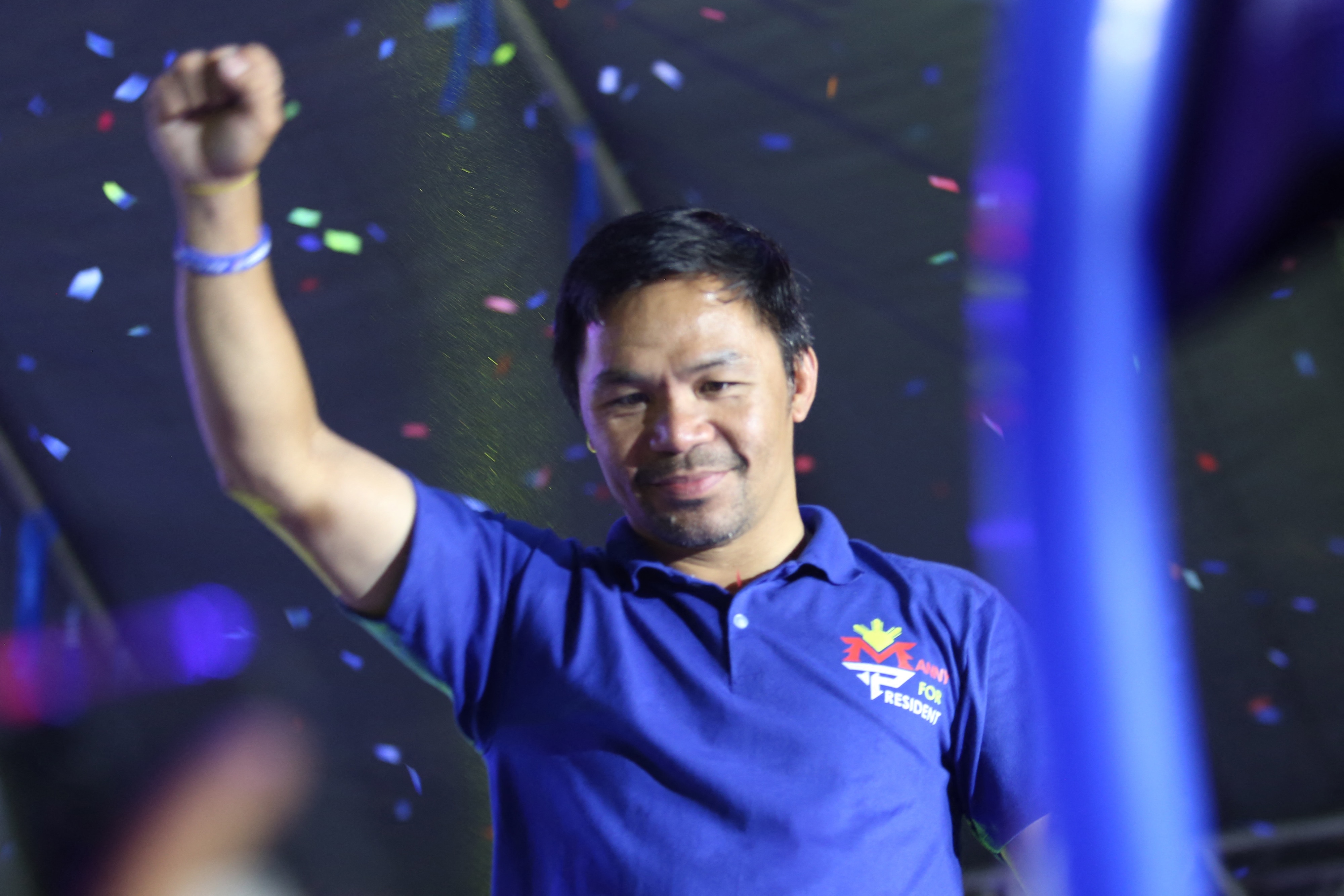 This photo taken on May 7, 2022 shows Philippine boxing icon and presidential candidate Manny Pacquiao raising a clinched fist during a campaign rally in General Santos City, on the southern island of Mindanao. (Photo by AFP) (Photo by STR/AFP via Getty Images)