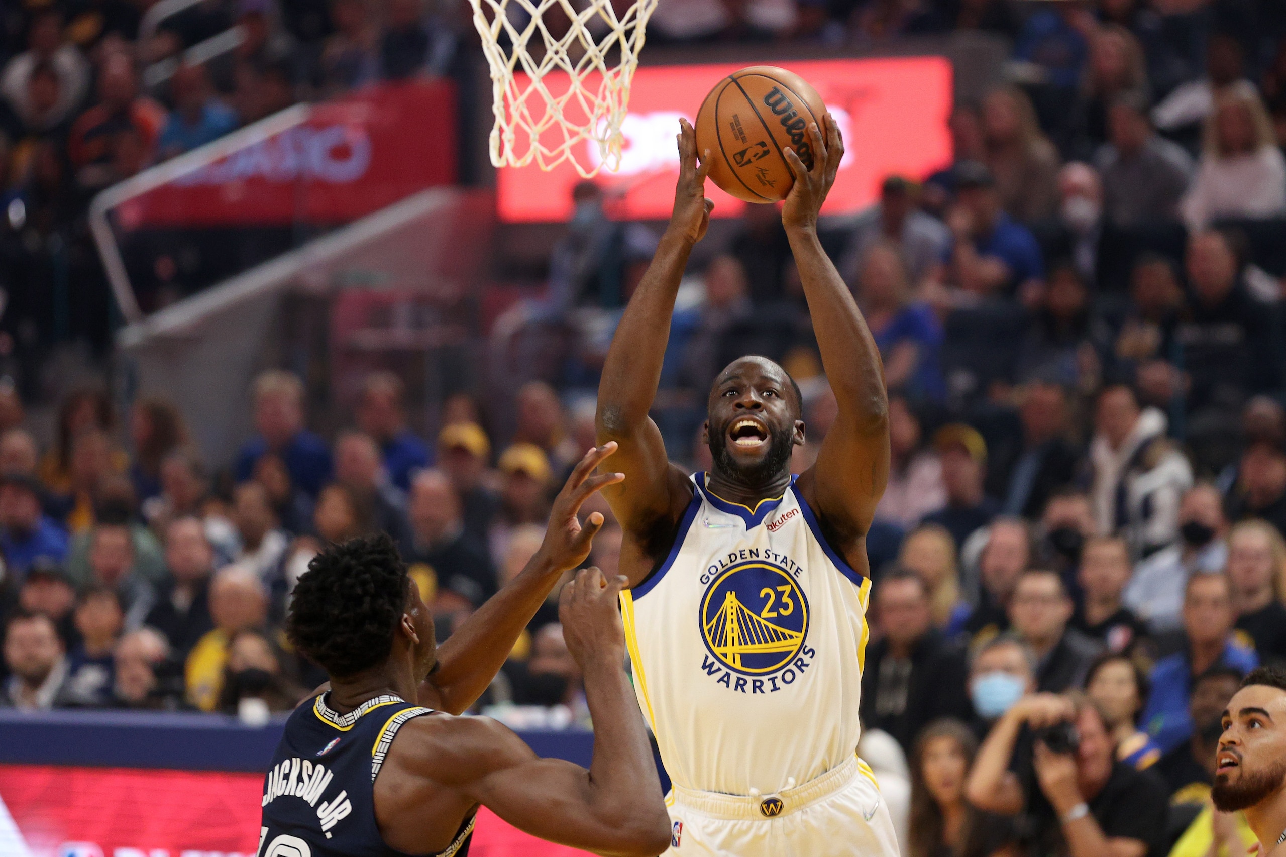 SAN FRANCISCO, CALIFORNIA - MAY 09: Draymond Green #23 of the Golden State Warriors shoots over Jaren Jackson Jr. #13 of the Memphis Grizzlies during Game Four of the Western Conference Semifinals of the NBA Playoffs at Chase Center on May 09, 2022 in San Francisco, California. NOTE TO USER: User expressly acknowledges and agrees that, by downloading and/or using this photograph, User is consenting to the terms and conditions of the Getty Images License Agreement. (Photo by Ezra Shaw/Getty Images)