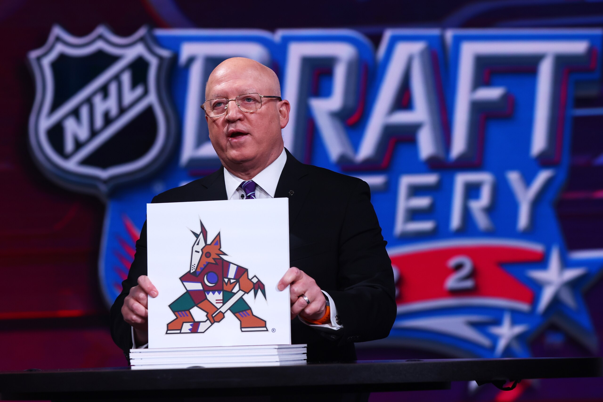 SECAUCUS, NEW JERSEY - MAY 10: National Hockey League Deputy Commissioner Bill Daly announces the Arizona Coyotes #3 overall draft position during the 2022 NHL Draft Lottery on May 10, 2022 at the NHL Network's studio in Secaucus, New Jersey. (Photo by Mike Stobe/NHLI via Getty Images) SECAUCUS, NEW JERSEY - MAY 10: National Hockey League Deputy Commissioner Bill Daly announces the Arizona Coyotes #3 overall draft position during the 2022 NHL Draft Lottery on May 10, 2022 at the NHL Network's studio in Secaucus, New Jersey. (Photo by Mike Stobe/NHLI via Getty Images)