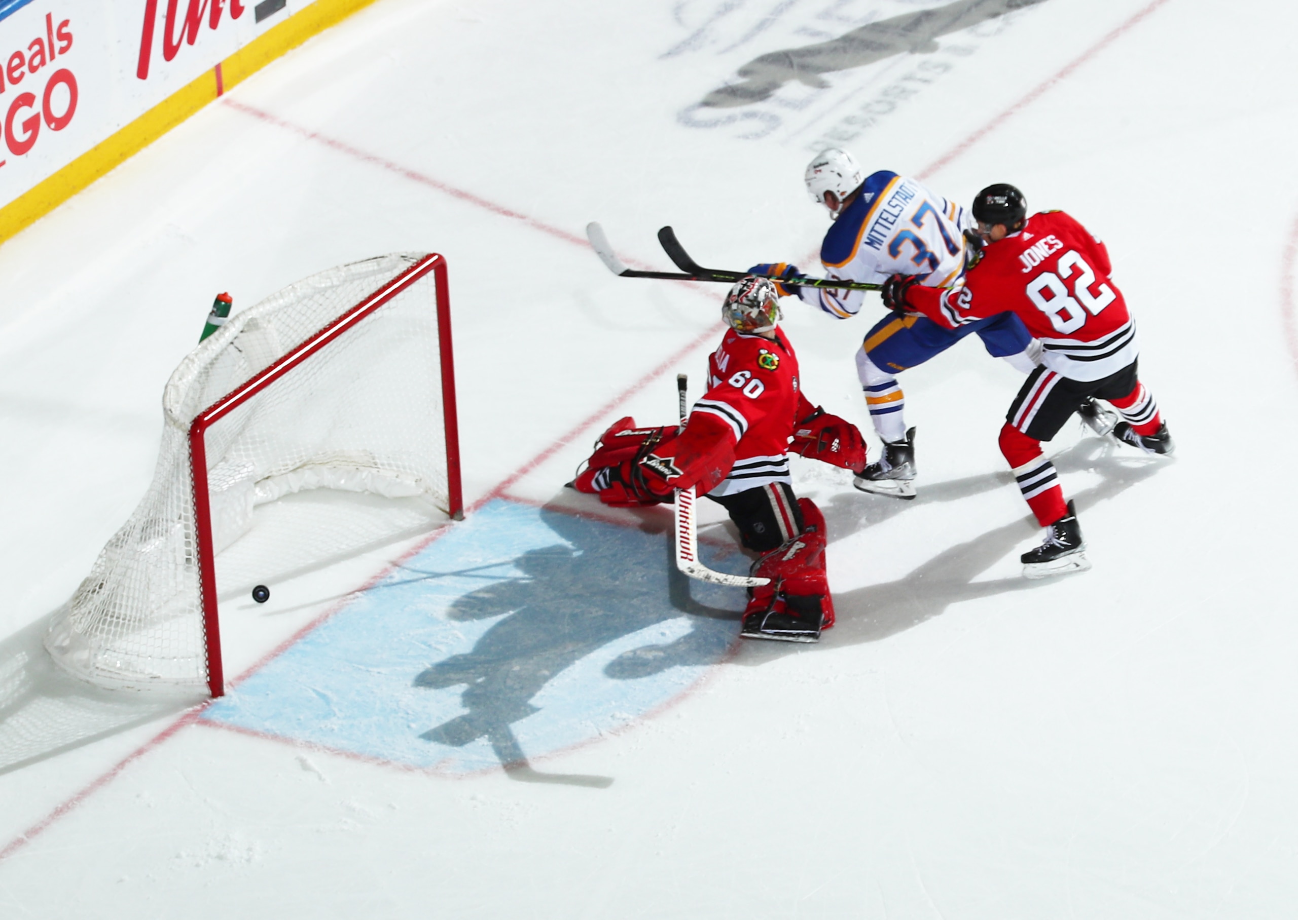 BUFFALO, NY - APRIL 29: Casey Mittelstadt #37 of the Buffalo Sabres scores the overtime winning goal against Collin Delia #60 of the Chicago Blackhawks during an NHL game on April 29, 2022 at KeyBank Center in Buffalo, New York. Buffalo won in overtime, 3-2. (Photo by Bill Wippert/NHLI via Getty Images) BUFFALO, NY - APRIL 29: Casey Mittelstadt #37 of the Buffalo Sabres scores the overtime winning goal against Collin Delia #60 of the Chicago Blackhawks during an NHL game on April 29, 2022 at KeyBank Center in Buffalo, New York. Buffalo won in overtime, 3-2. (Photo by Bill Wippert/NHLI via Getty Images)