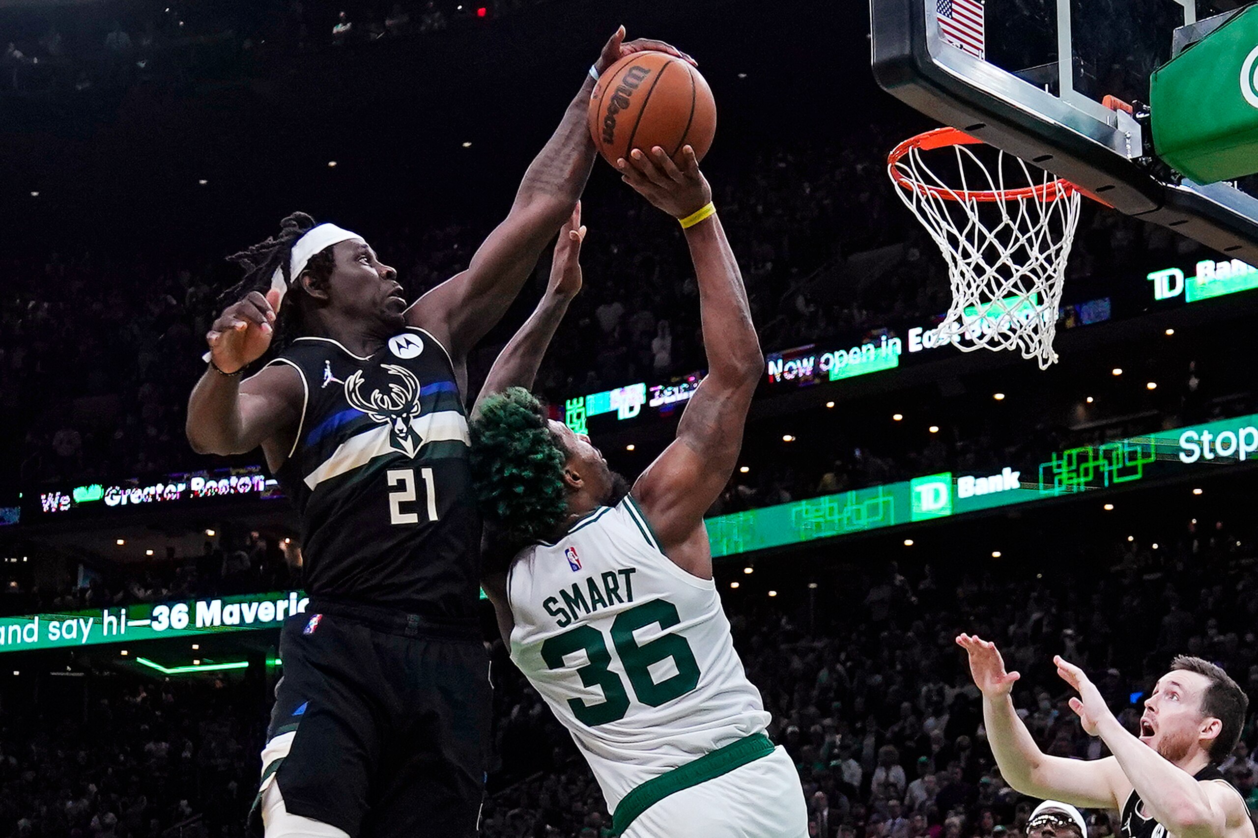 Milwaukee Bucks guard Jrue Holiday (21) blocks a shot by Boston Celtics guard Marcus Smart (36) in the final seconds of play during the second half of Game 5 of an Eastern Conference semifinal in the NBA basketball playoffs, Wednesday, May 11, 2022, in Boston. The Bucks won 110-107. (AP Photo/Charles Krupa) Milwaukee Bucks guard Jrue Holiday (21) blocks a shot by Boston Celtics guard Marcus Smart (36) in the final seconds of play during the second half of Game 5 of an Eastern Conference semifinal in the NBA basketball playoffs, Wednesday, May 11, 2022, in Boston. The Bucks won 110-107. (AP Photo/Charles Krupa)