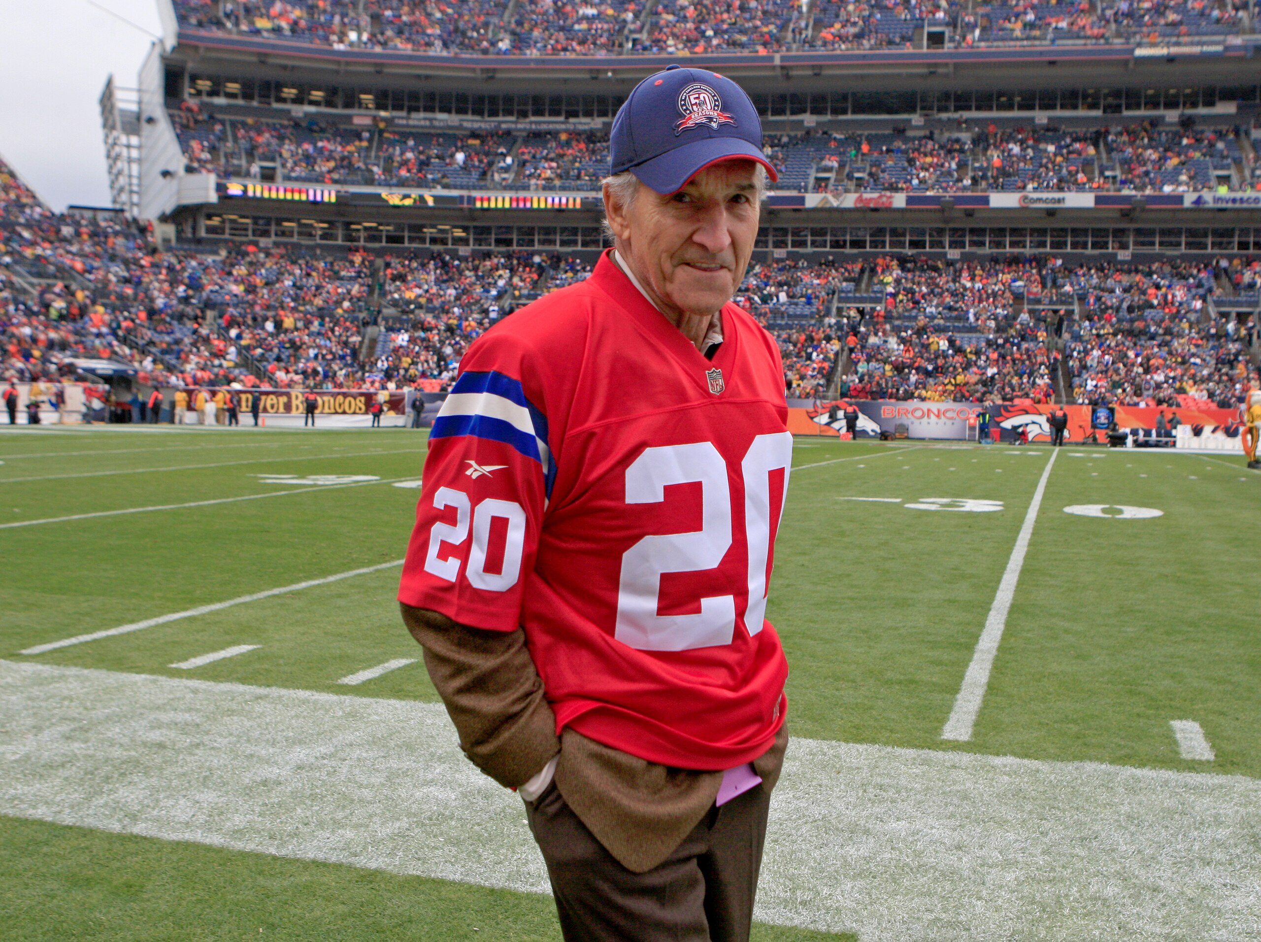 DENVER - OCTOBER 11: The New England Patriots legend Gino Cappelletti stands on the sidelines for the ceremonial coin toss before their game against the Denver Broncos at Invesco Field on Sunday,  Oct. 11, 2009. (Photo by Matthew J. Lee/The Boston Globe via Getty Images)