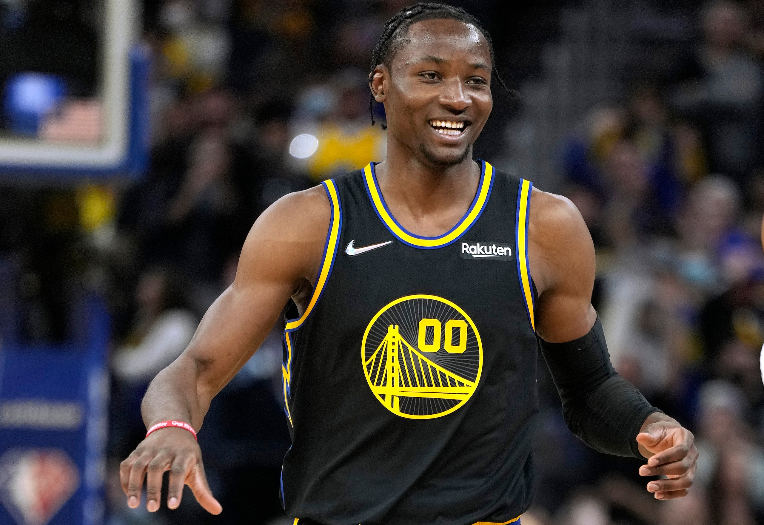 SAN FRANCISCO, CALIFORNIA - MAY 07: Jonathan Kuminga #00 of the Golden State Warriors reacts with a smile after making a three-point shot against the Memphis Grizzlies during the second half of Game Three of the Western Conference Semifinals of the NBA Playoffs at Chase Center on May 07, 2022 in San Francisco, California. NOTE TO USER: User expressly acknowledges and agrees that, by downloading and or using this photograph, User is consenting to the terms and conditions of the Getty Images License Agreement. (Photo by Thearon W. Henderson/Getty Images)