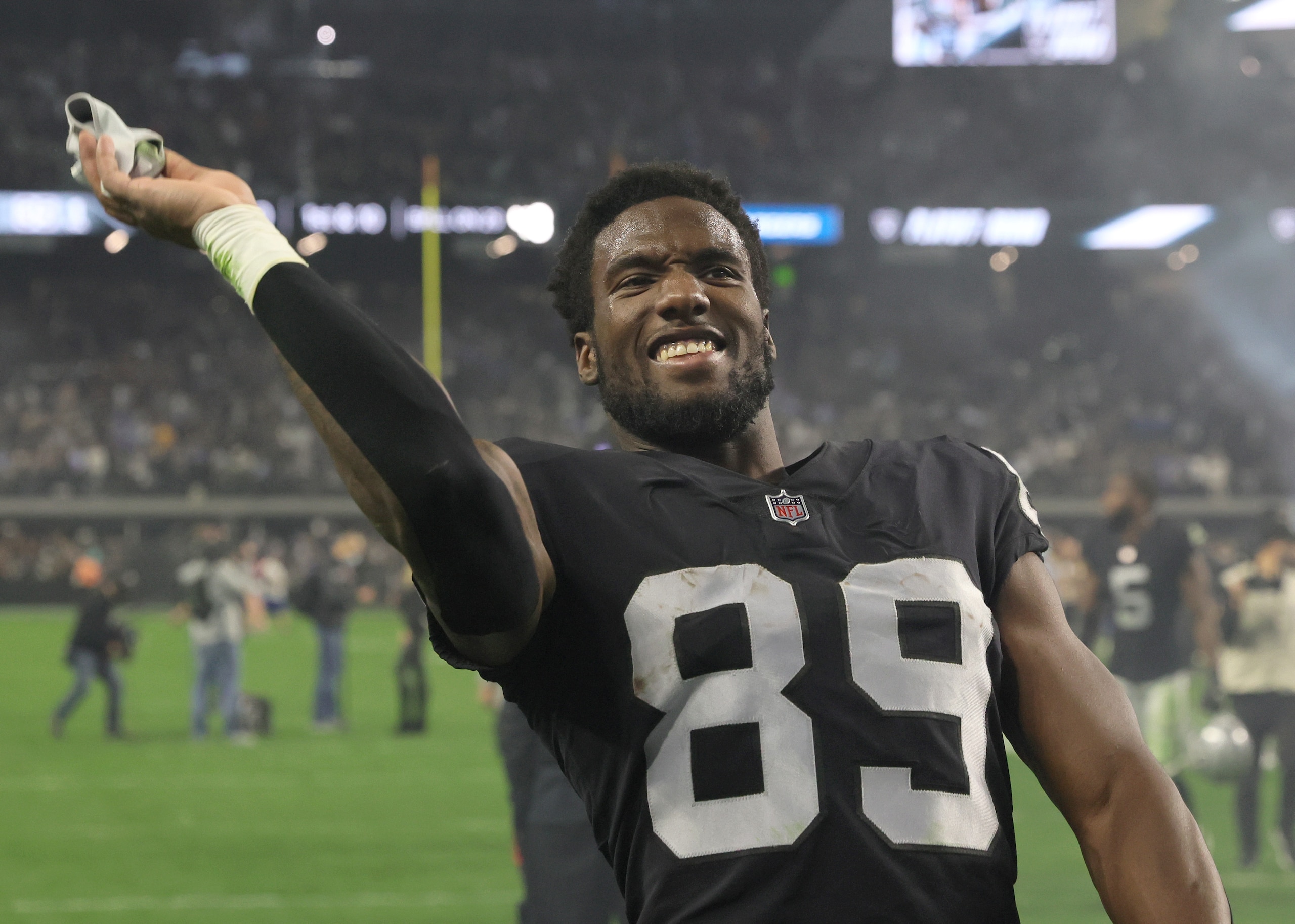 LAS VEGAS, NEVADA - JANUARY 09:  Wide receiver Bryan Edwards #89 of the Las Vegas Raiders throws his gloves to fans as he walks off the field after the team's 35-32 overtime victory over the Los Angeles Chargers at Allegiant Stadium on January 9, 2022 in Las Vegas, Nevada.  (Photo by Ethan Miller/Getty Images)