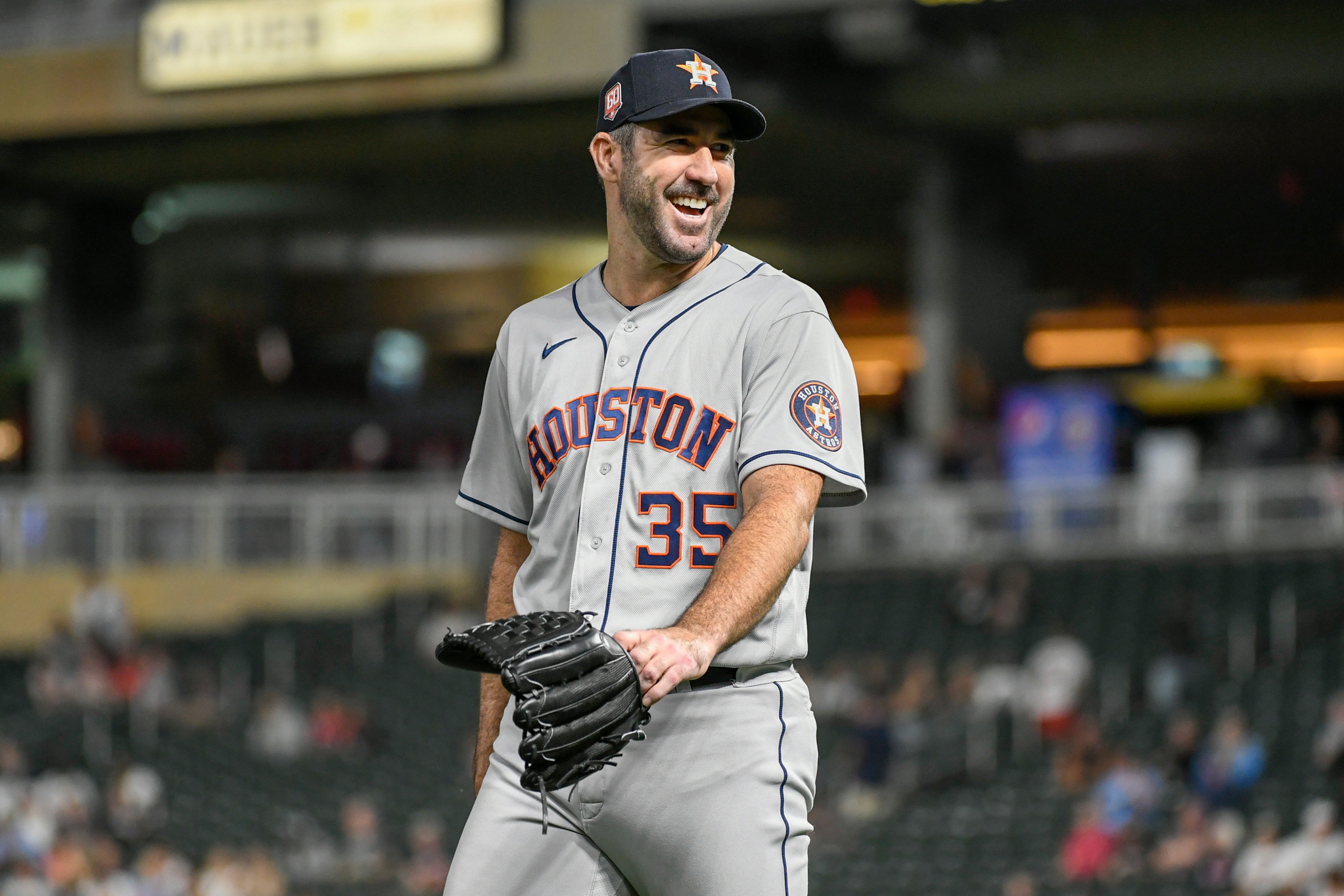 Houston Astros pitcher Justin Verlander smiles as he heads to the dugout after completing eight innings and allowing the Minnesota Twins only one hit during the eighth inning of a baseball game, Tuesday, May 10, 2022, in Minneapolis. (AP Photo/Craig Lassig) Houston Astros pitcher Justin Verlander smiles as he heads to the dugout after completing eight innings and allowing the Minnesota Twins only one hit during the eighth inning of a baseball game, Tuesday, May 10, 2022, in Minneapolis. (AP Photo/Craig Lassig)