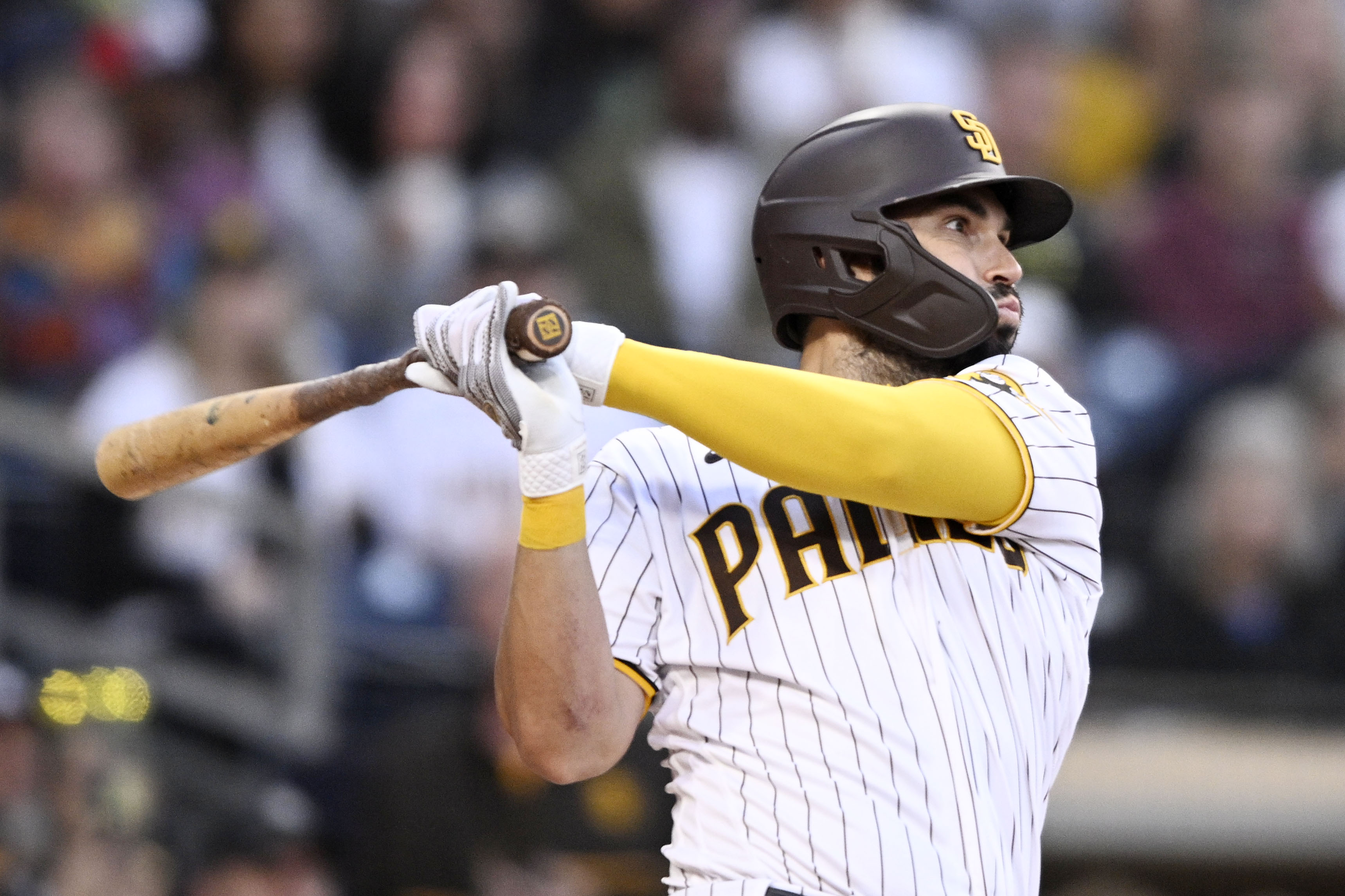SAN DIEGO, CA - MAY 6 : Eric Hosmer #30 of the San Diego Padres hits an RBI double during the first inning of a baseball game against the Miami Marlins on May 6, 2022 at Petco Park in San Diego, California. (Photo by Denis Poroy/Getty Images)