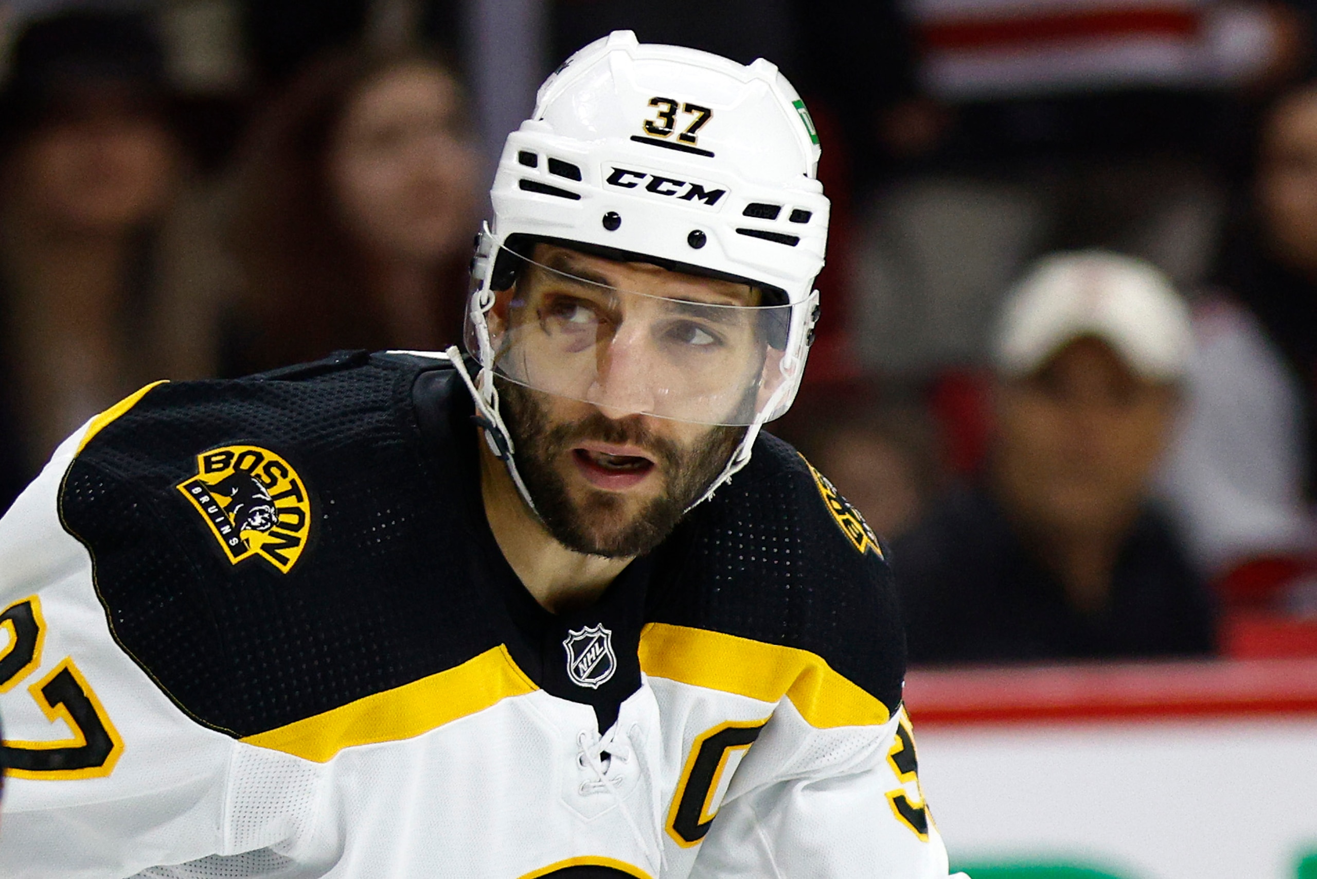RALEIGH, NORTH CAROLINA - MAY 14: Patrice Bergeron #37 of the Boston Bruins looks on in Game Seven of the First Round of the 2022 Stanley Cup Playoffs against the Carolina Hurricanes at PNC Arena on May 14, 2022 in Raleigh, North Carolina. (Photo by Jared C. Tilton/Getty Images)