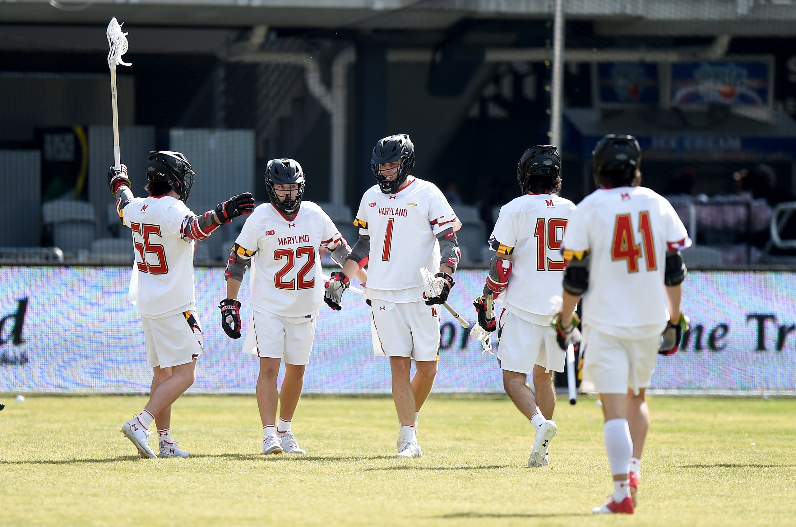WASHINGTON, DC - MARCH 19: Logan Wisnauskas #1 of the Maryland Terrapins celebrates with teammates during the game against the Virginia Cavaliers at Audi Field on March 19, 2022 in Washington, DC. (Photo by G Fiume/Getty Images)