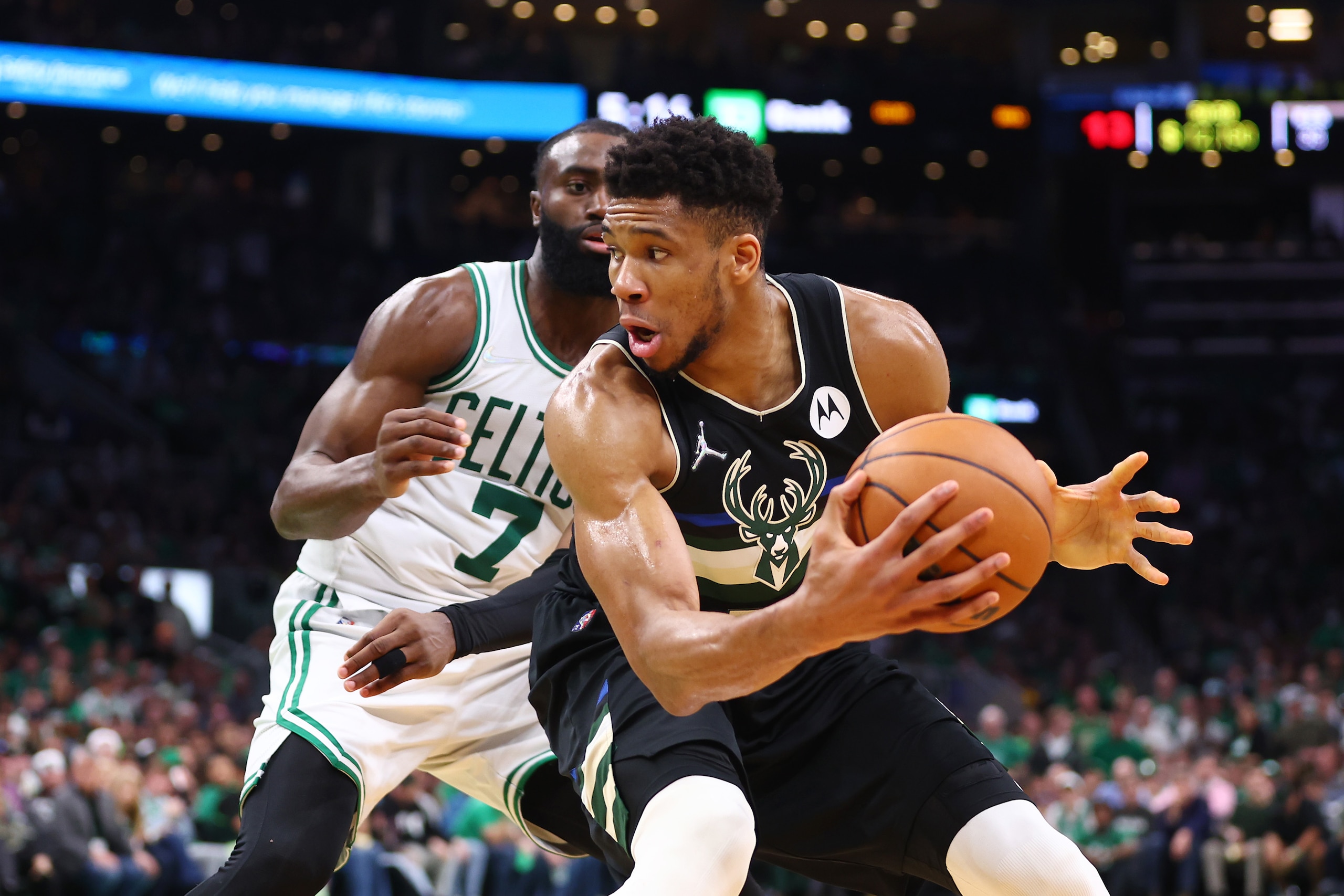 BOSTON, MASSACHUSETTS - MAY 15: Giannis Antetokounmpo #34 of the Milwaukee Bucks handles the ball against Jaylen Brown #7 of the Boston Celtics during the third quarter in Game Seven of the 2022 NBA Playoffs Eastern Conference Semifinals at TD Garden on May 15, 2022 in Boston, Massachusetts. NOTE TO USER: User expressly acknowledges and agrees that, by downloading and/or using this photograph, User is consenting to the terms and conditions of the Getty Images License Agreement. (Photo by Adam Glanzman/Getty Images)