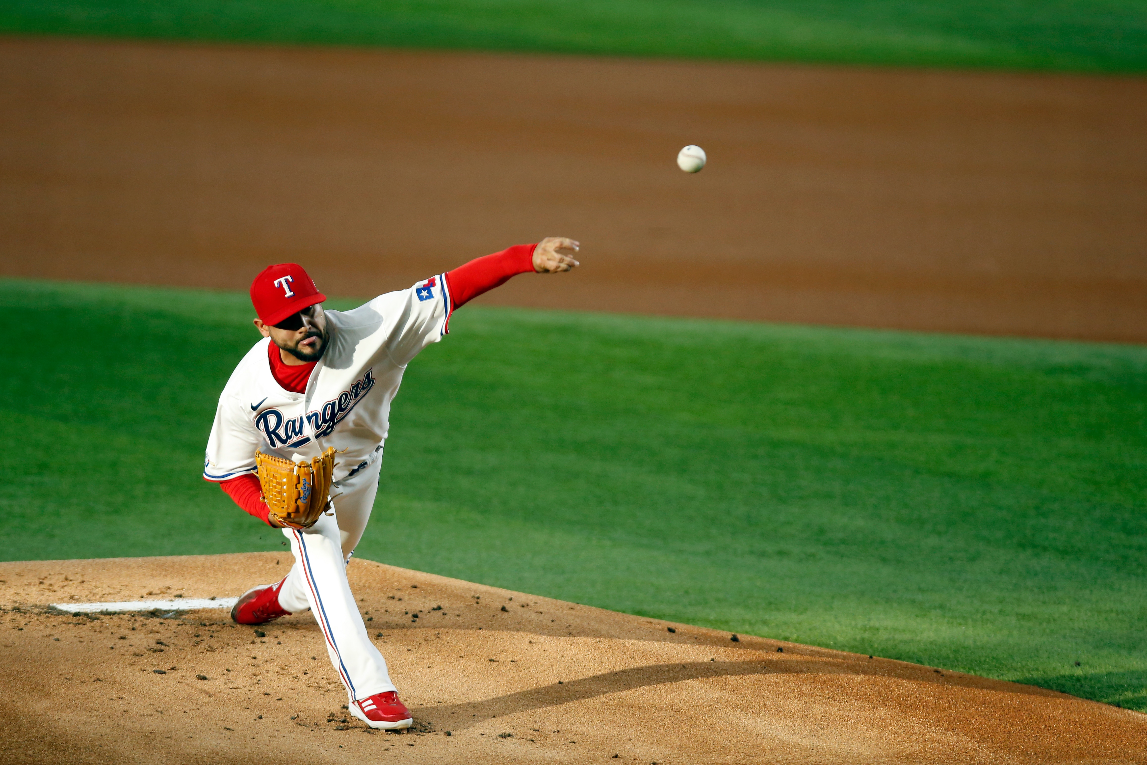 ARLINGTON, TEXAS - MAY 10: Martin Perez #54 of the Texas Rangers throws a pitch against the Kansas City Royals in the first inning at Globe Life Field on May 10, 2022 in Arlington, Texas. (Photo by Tim Heitman/Getty Images)