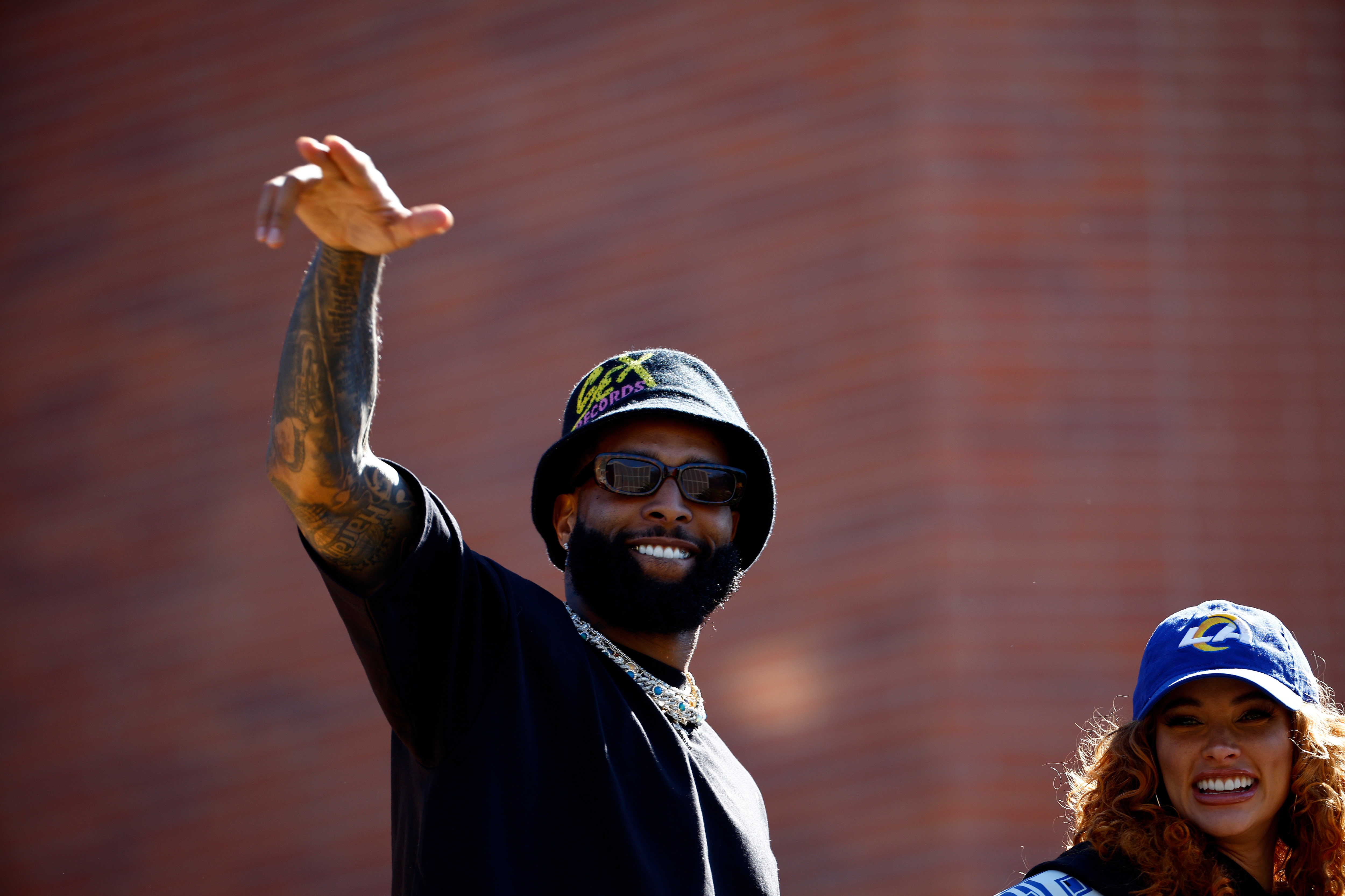 LOS ANGELES, CALIFORNIA - FEBRUARY 16:   Odell Beckham Jr. #3 of the Los Angeles Rams and Lauren Wood celebrate during the Los Angeles Rams Super Bowl LVI Victory Parade on February 16, 2022 in Los Angeles, California. (Photo by Ronald Martinez/Getty Images)
