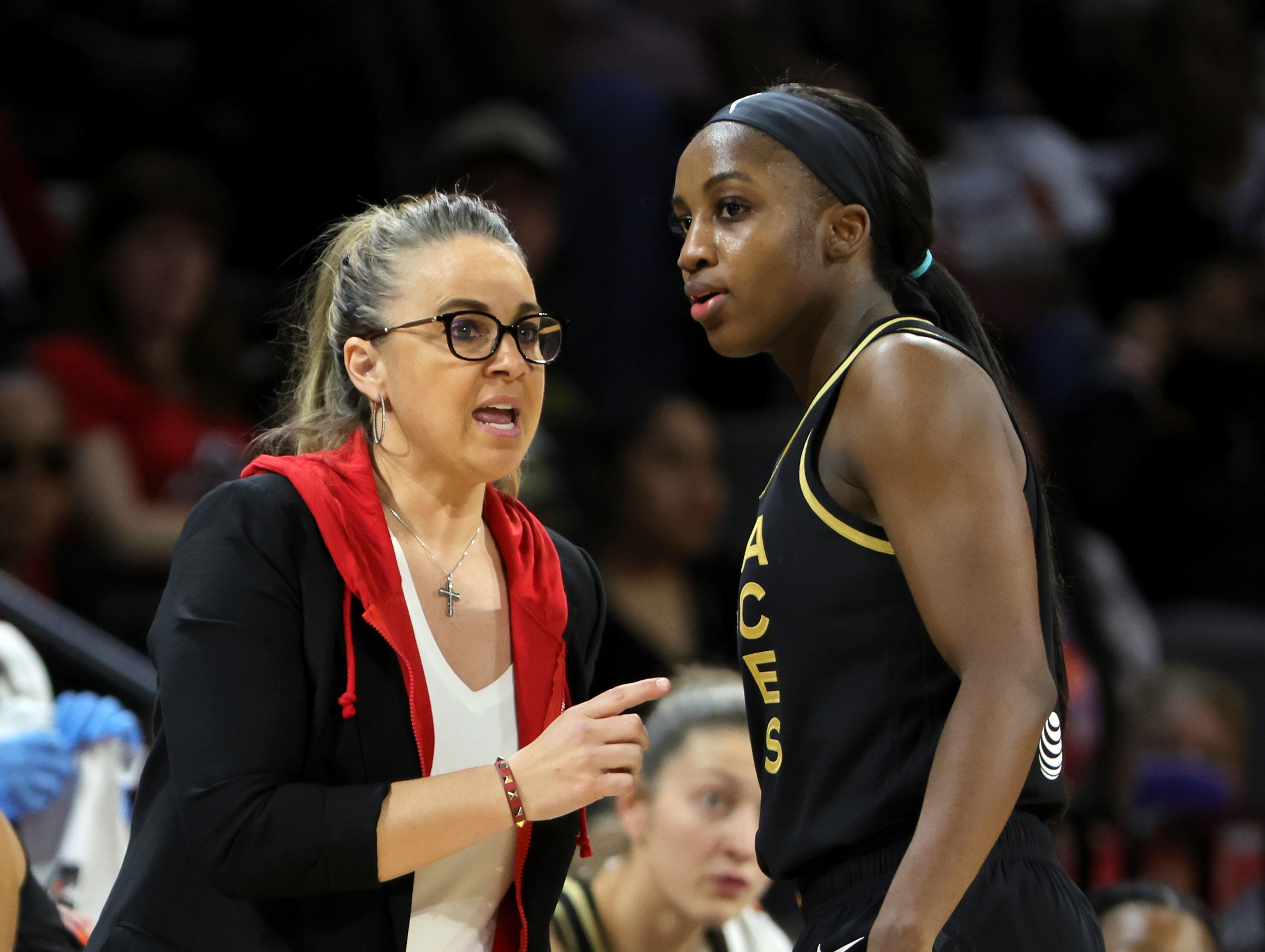 LAS VEGAS, NEVADA - MAY 08: Head coach Becky Hammon of the Las Vegas Aces talks with Jackie Young #0 during their game against the Seattle Storm at Michelob ULTRA Arena on May 08, 2022 in Las Vegas, Nevada. The Aces defeated the Storm 85-74. NOTE TO USER: User expressly acknowledges and agrees that, by downloading and or using this photograph, User is consenting to the terms and conditions of the Getty Images License Agreement. (Photo by Ethan Miller/Getty Images)